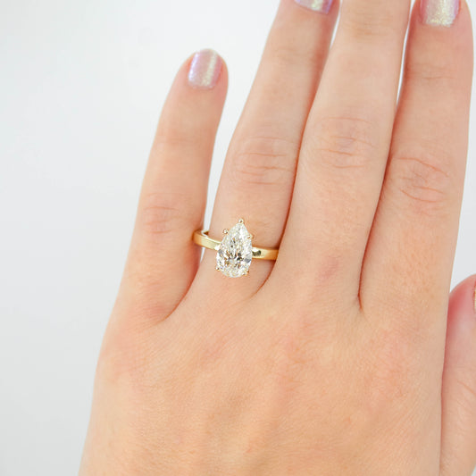 Adele Ring with a 1.98 Carat Lab Grown Pear Diamond and Hidden Diamond Halo in 14k Yellow Gold - Ready to Size and Ship - Midwinter Co. Alternative Bridal Rings and Modern Fine Jewelry