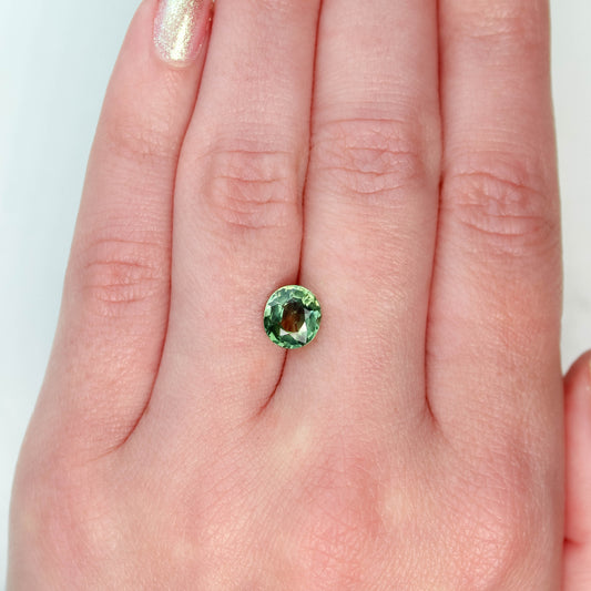 CAELEN (J) 2.18 Carat Yellow-Green Oval Sapphire for Custom Work - Inventory Code MCOS218 - Midwinter Co. Alternative Bridal Rings and Modern Fine Jewelry