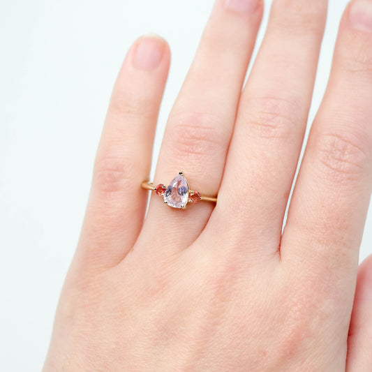 Drea Ring with a 1.32 Carat Pink Pear Sapphire and Orange Sapphire Accents in 14k Yellow Gold - Ready to Size and Ship - Midwinter Co. Alternative Bridal Rings and Modern Fine Jewelry