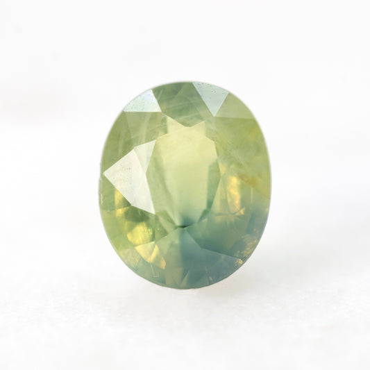1.39 Carat Light Green Bicolor Oval Sapphire for Custom Work - Inventory Code GBOS139 - Midwinter Co. Alternative Bridal Rings and Modern Fine Jewelry