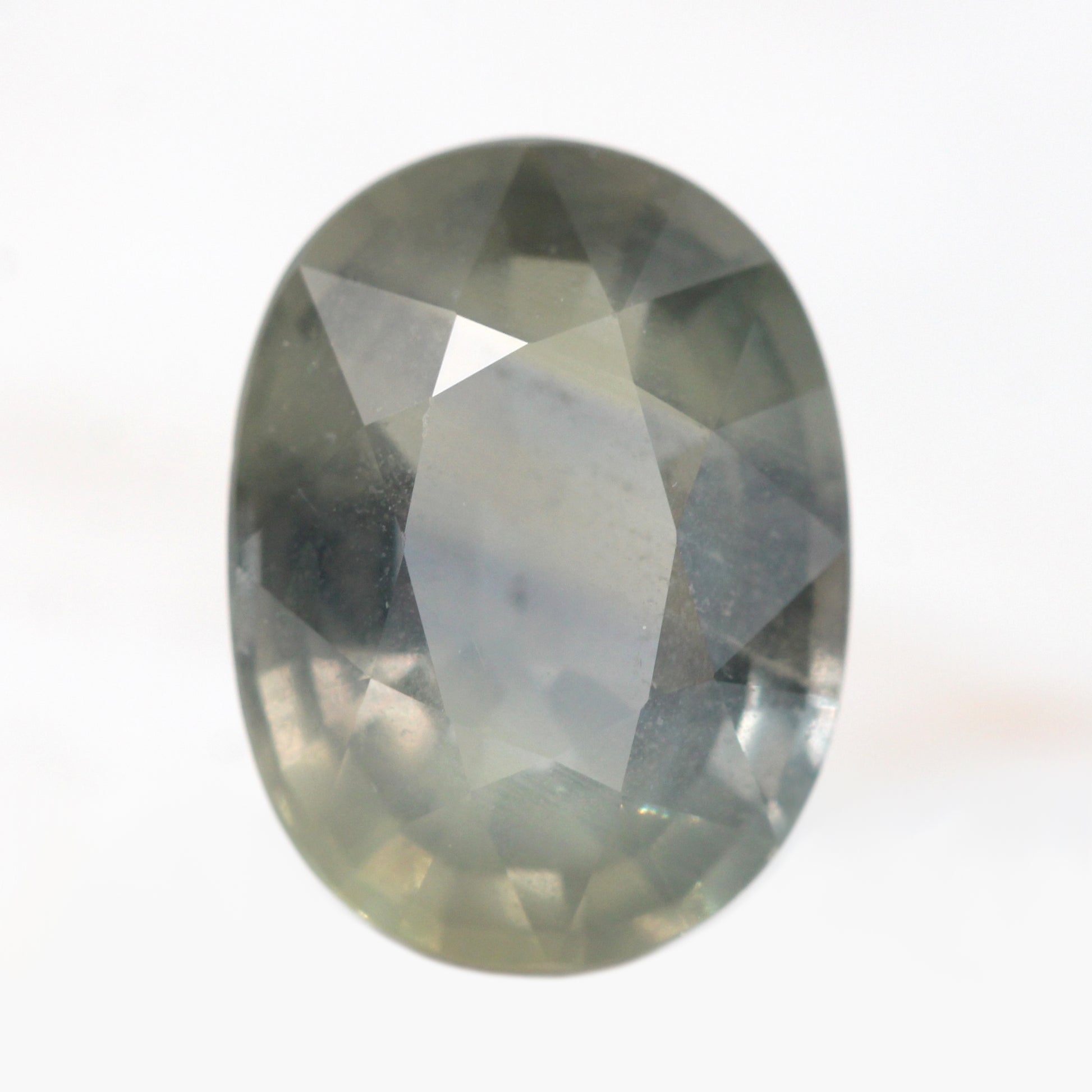 5.88 Carat Earthy Gray Color Change Oval Sapphire for Custom Work - Inventory Code GOS588 - Midwinter Co. Alternative Bridal Rings and Modern Fine Jewelry