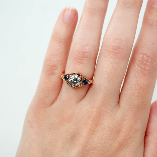 Cassia Ring with a 1.00 Carat Round Gray Moissanite and Blue Sapphire Accents in 10k Rose Gold - Ready to Size and Ship - Midwinter Co. Alternative Bridal Rings and Modern Fine Jewelry