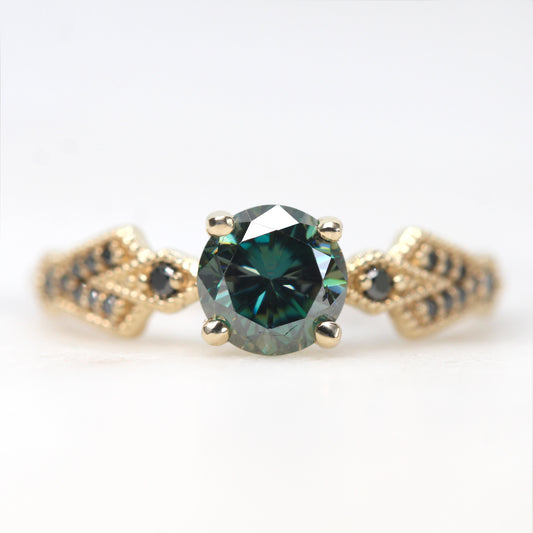 Darian Ring with a 0.80 Carat Round Black and Teal Moissanite and Black Accent Diamonds in 10k Yellow Gold - Ready to Size and Ship