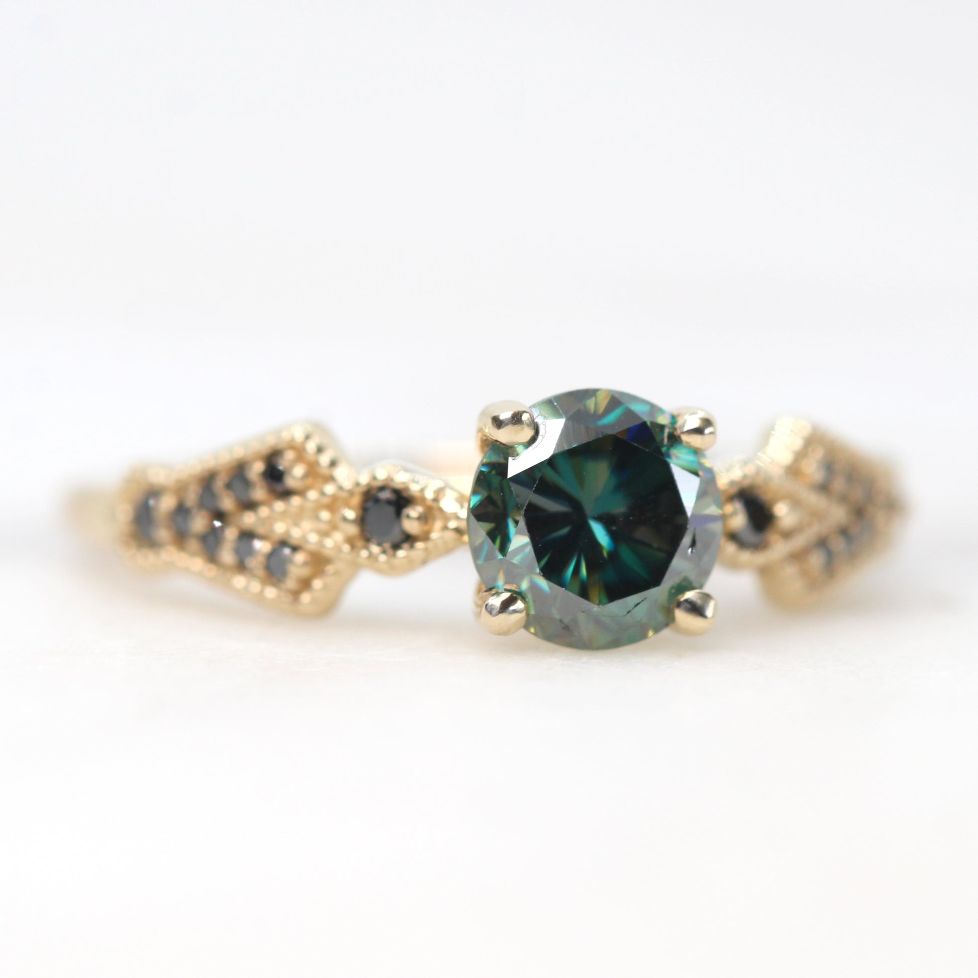 Darian Ring with a 0.80 Carat Round Black and Teal Moissanite and Black Accent Diamonds in 10k Yellow Gold - Ready to Size and Ship - Midwinter Co. Alternative Bridal Rings and Modern Fine Jewelry