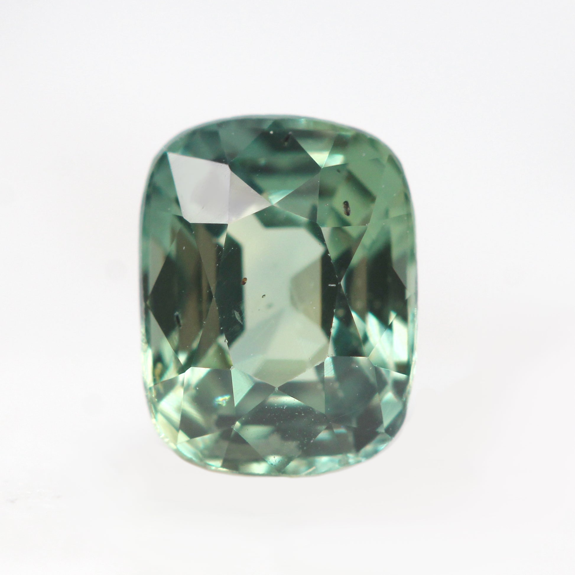 1.09 Carat Light Teal Green Cushion Cut Sapphire for Custom Work - Inventory Code TGCS109 - Midwinter Co. Alternative Bridal Rings and Modern Fine Jewelry