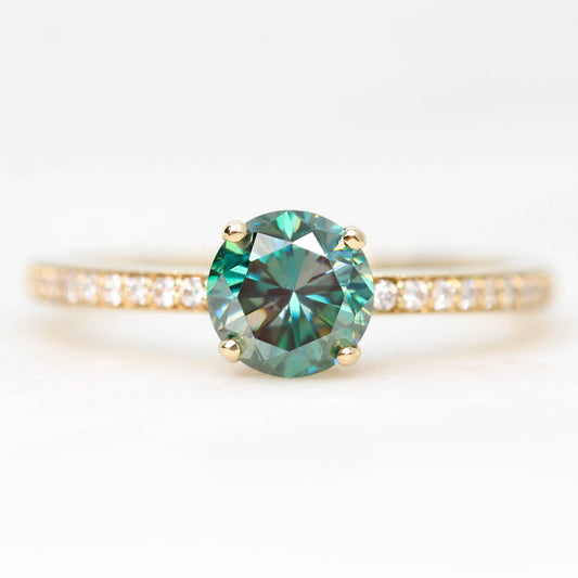 Imani Ring with a 0.80 Carat Round Black and Teal Moissanite and White Accent Diamonds in 14k Yellow Gold - Ready to Size and Ship