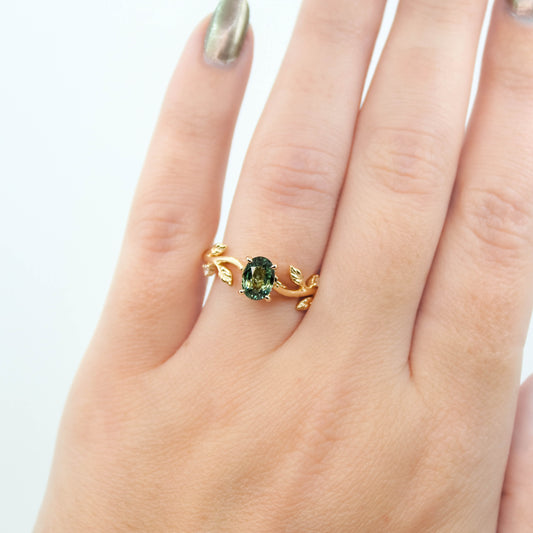 Vinia Ring with a 1.04 Carat Teal Oval Sapphire and White Accent and Hidden Diamonds in 14k Yellow Gold - Ready to Size and Ship
