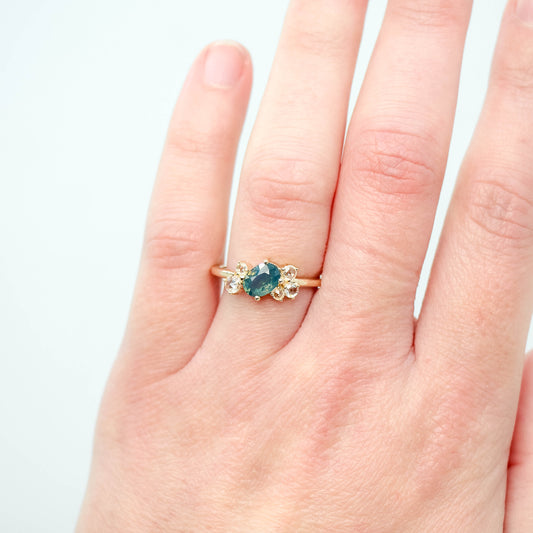 Lexus Ring with a 0.90 Carat Teal Oval Sapphire and Clear Diamond Accents in 10k Yellow Gold - Ready to Size and Ship - Midwinter Co. Alternative Bridal Rings and Modern Fine Jewelry