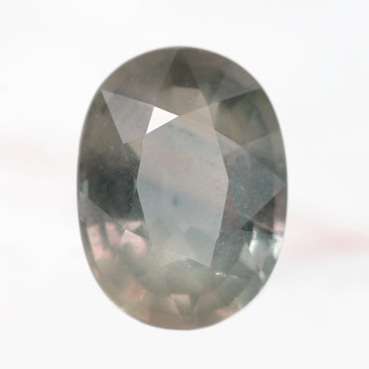 5.88 Carat Earthy Gray Color Change Oval Sapphire for Custom Work - Inventory Code GOS588 - Midwinter Co. Alternative Bridal Rings and Modern Fine Jewelry
