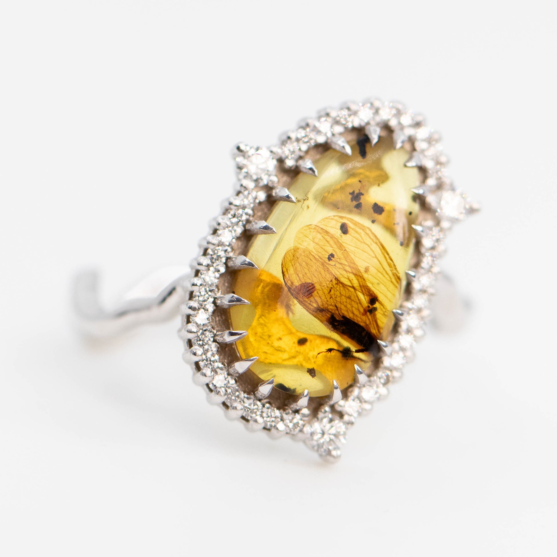 Beatrix Ring with a 1.33 Carat Pear Cabochon Amber with Internal Insect Wings and White Accent Diamonds in 14k White Gold - Ready to Size and Ship - Midwinter Co. Alternative Bridal Rings and Modern Fine Jewelry