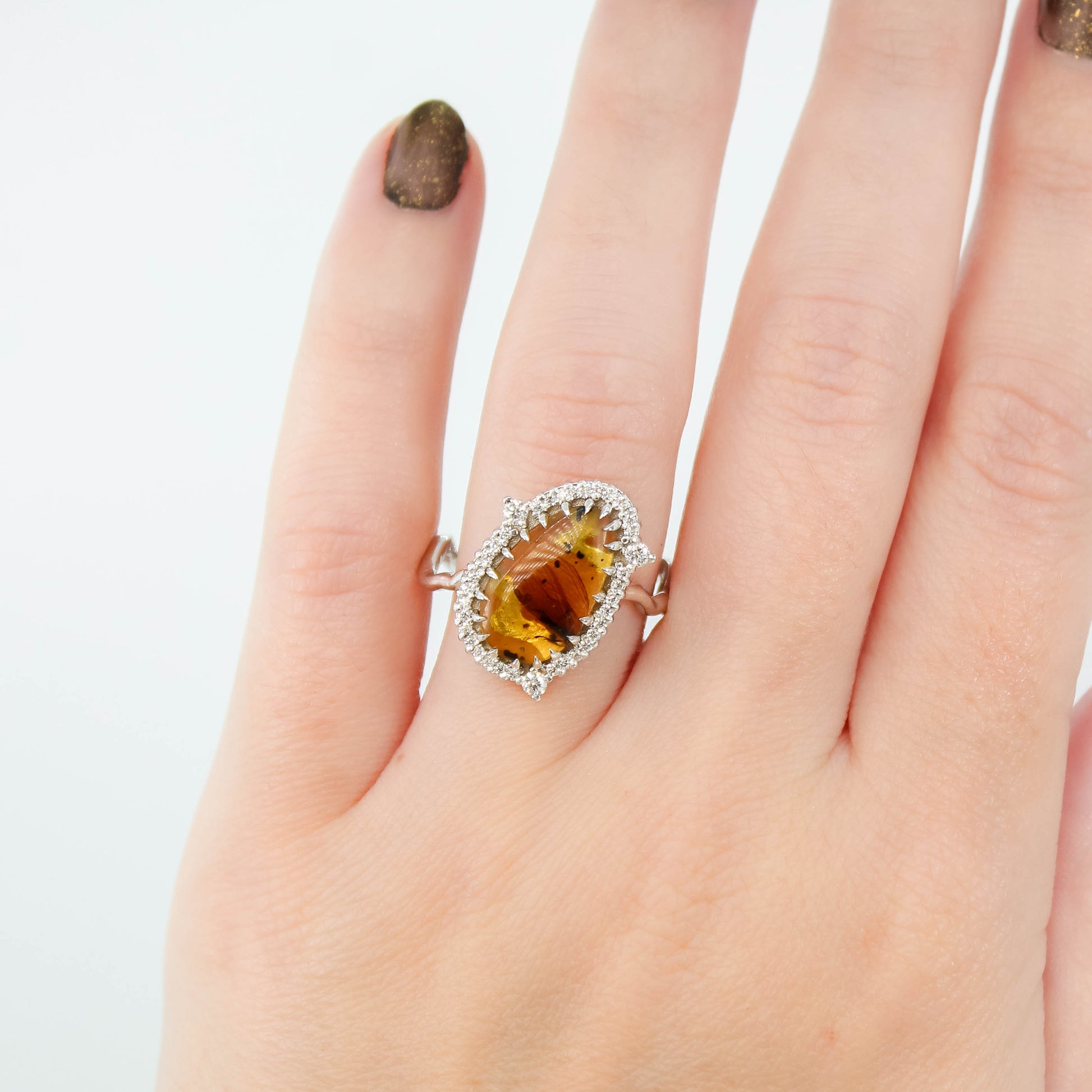 Beatrix Ring with a 1.33 Carat Pear Cabochon Amber with Internal Insect Wings and White Accent Diamonds in 14k White Gold - Ready to Size and Ship - Midwinter Co. Alternative Bridal Rings and Modern Fine Jewelry