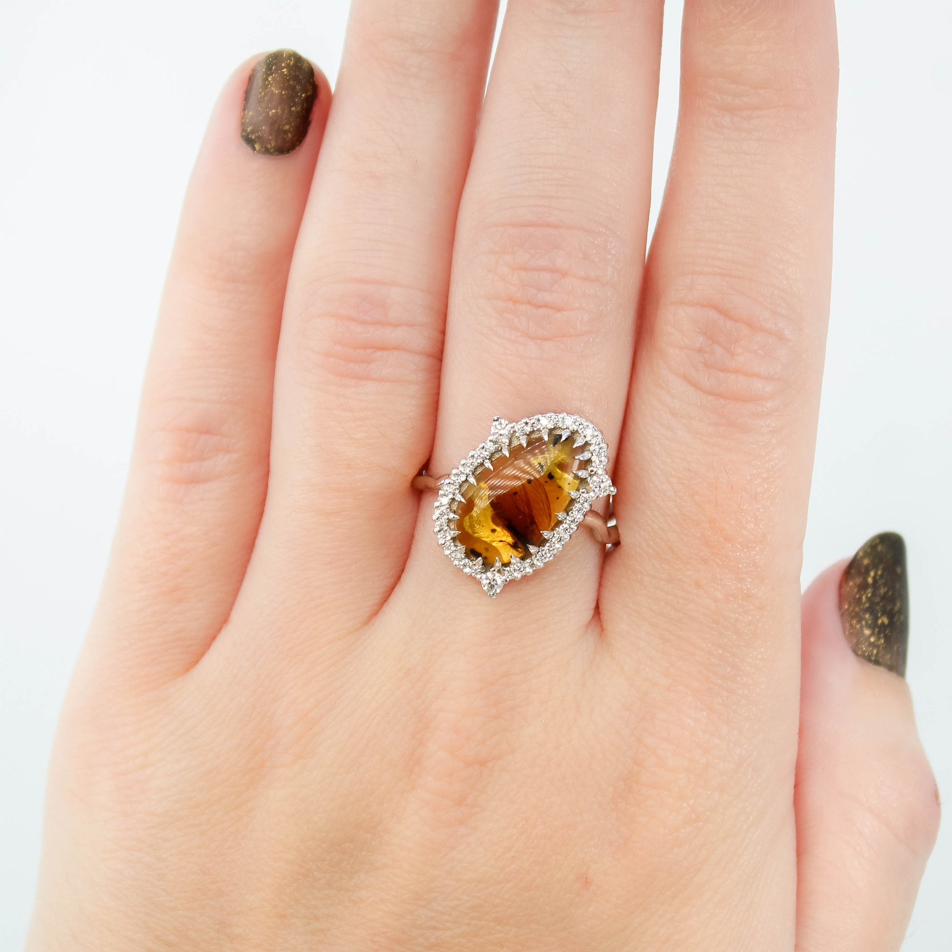 Beatrix Ring with a 1.33 Carat Pear Cabochon Amber with Internal Insect Wings and White Accent Diamonds in 14k White Gold - Ready to Size and Ship - Midwinter Co. Alternative Bridal Rings and Modern Fine Jewelry