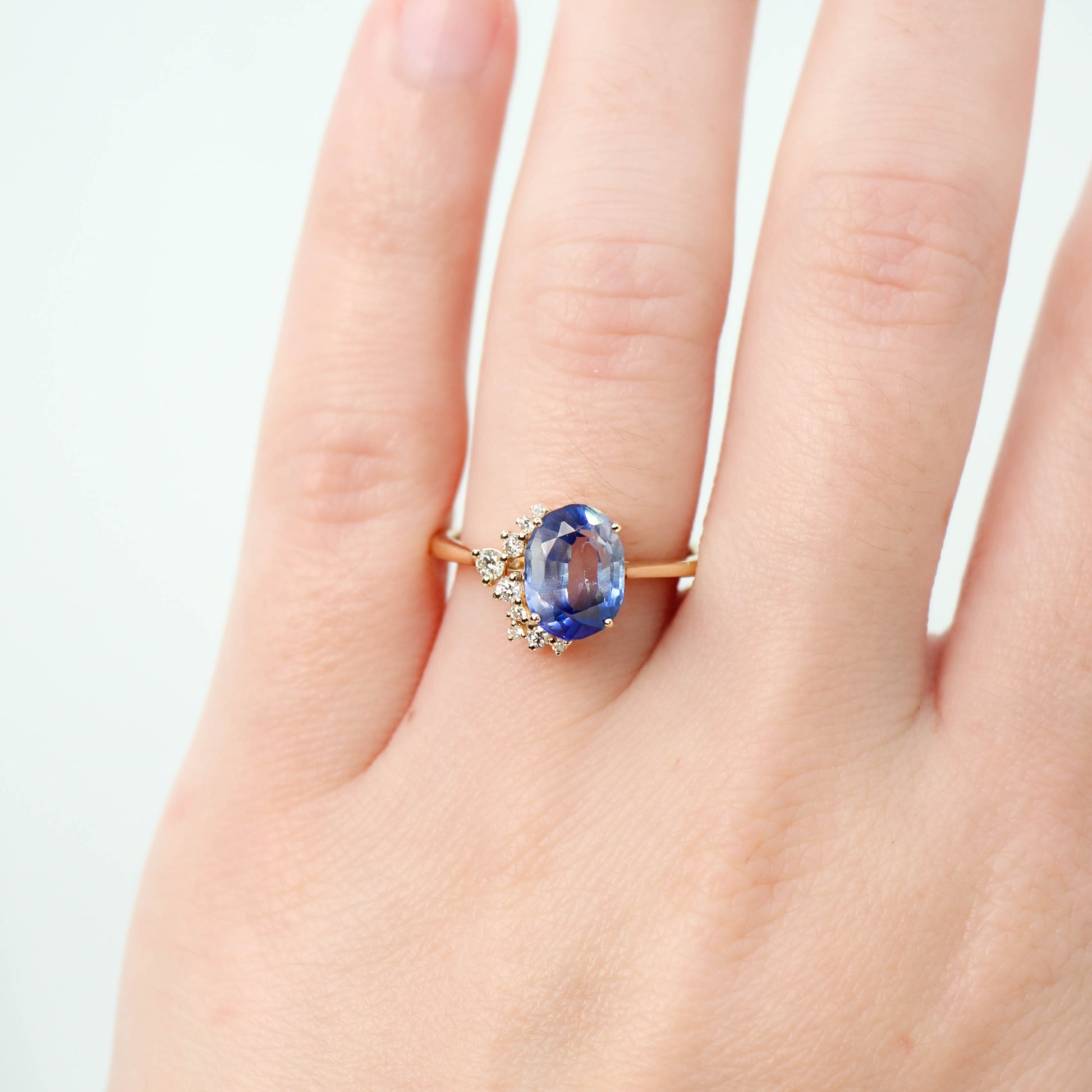 Anila Ring with a 2.63 Carat Oval Blue Sapphire and White Accent Diamonds in 14k Yellow Gold - Ready to Size and Ship - Midwinter Co. Alternative Bridal Rings and Modern Fine Jewelry