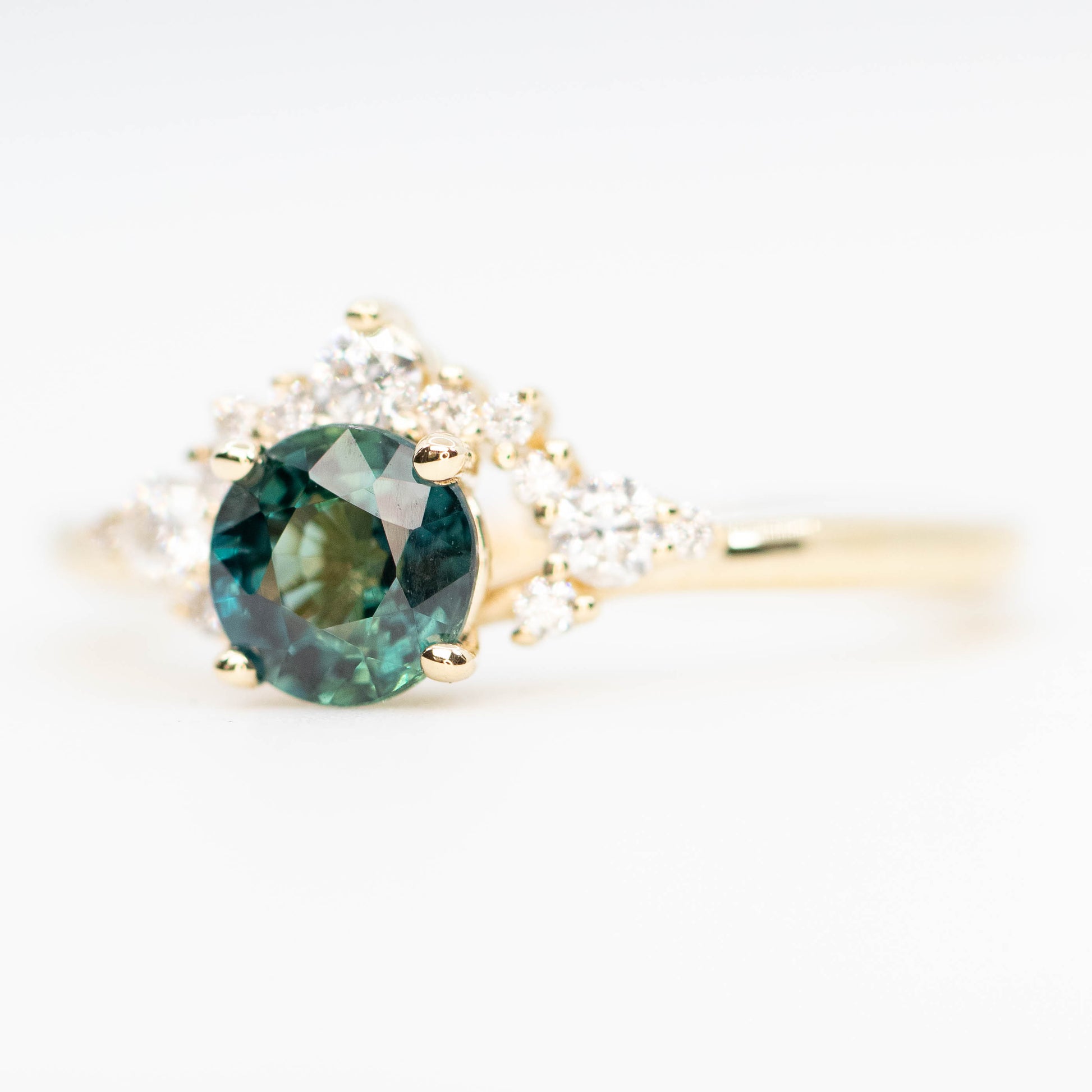 Athena Ring with a 0.85 Carat Teal Round Sapphire and White Accent Diamonds in 14k Yellow Gold - Ready to Size and Ship - Midwinter Co. Alternative Bridal Rings and Modern Fine Jewelry