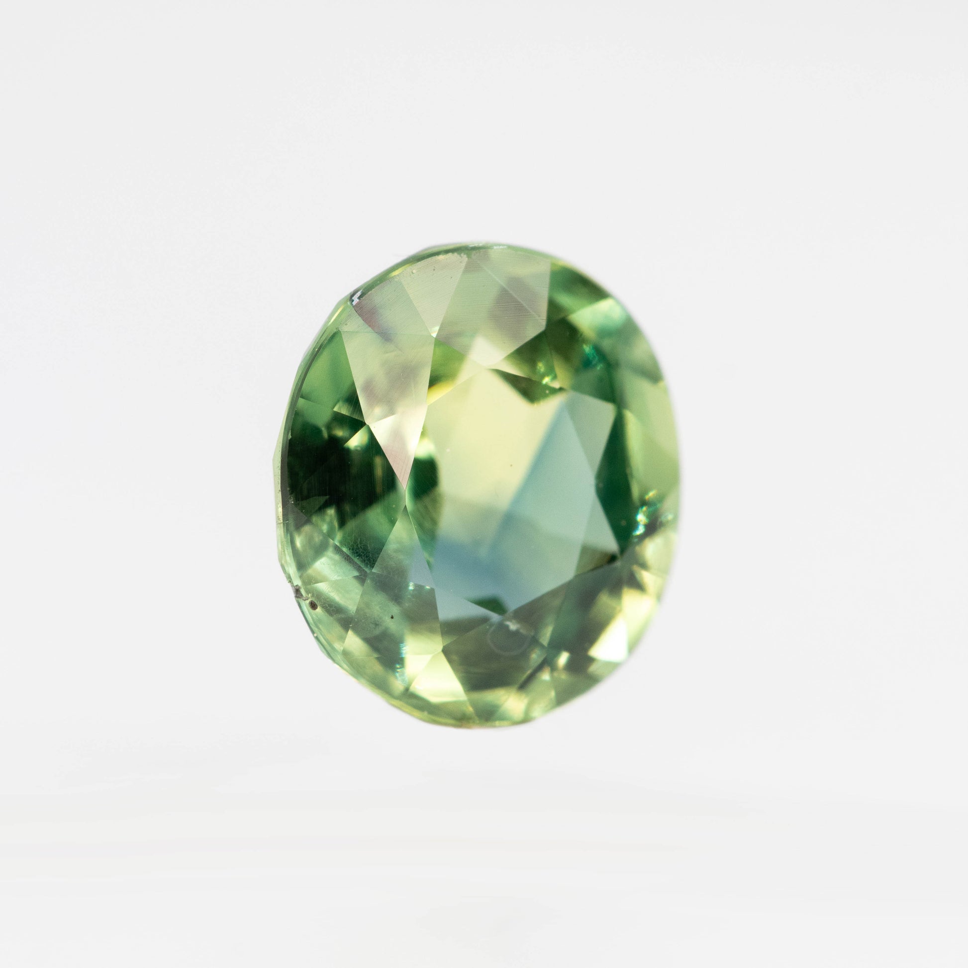 CAELEN (J) 2.18 Carat Yellow-Green Oval Sapphire for Custom Work - Inventory Code MCOS218 - Midwinter Co. Alternative Bridal Rings and Modern Fine Jewelry