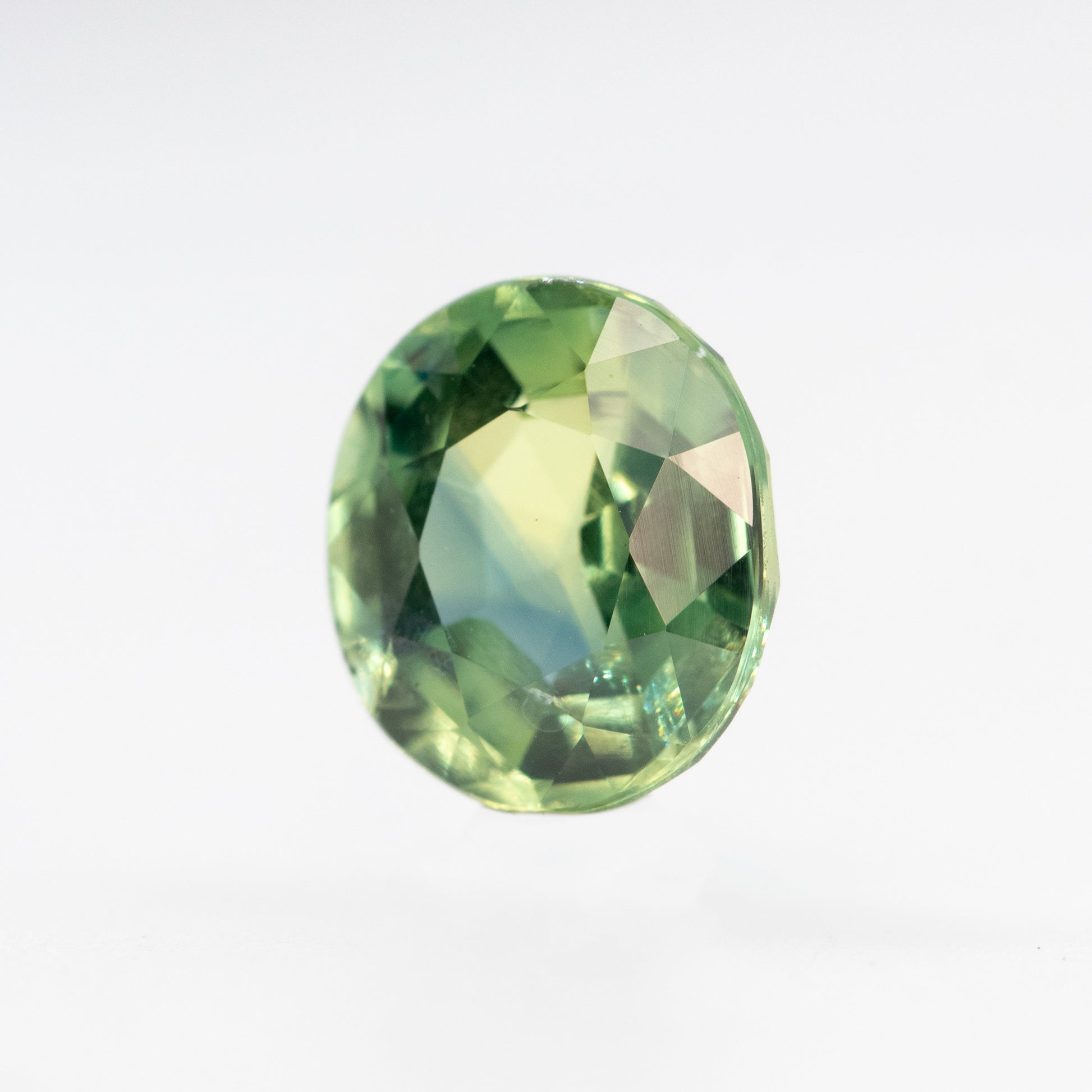 CAELEN (J) 2.18 Carat Yellow-Green Oval Sapphire for Custom Work - Inventory Code MCOS218 - Midwinter Co. Alternative Bridal Rings and Modern Fine Jewelry