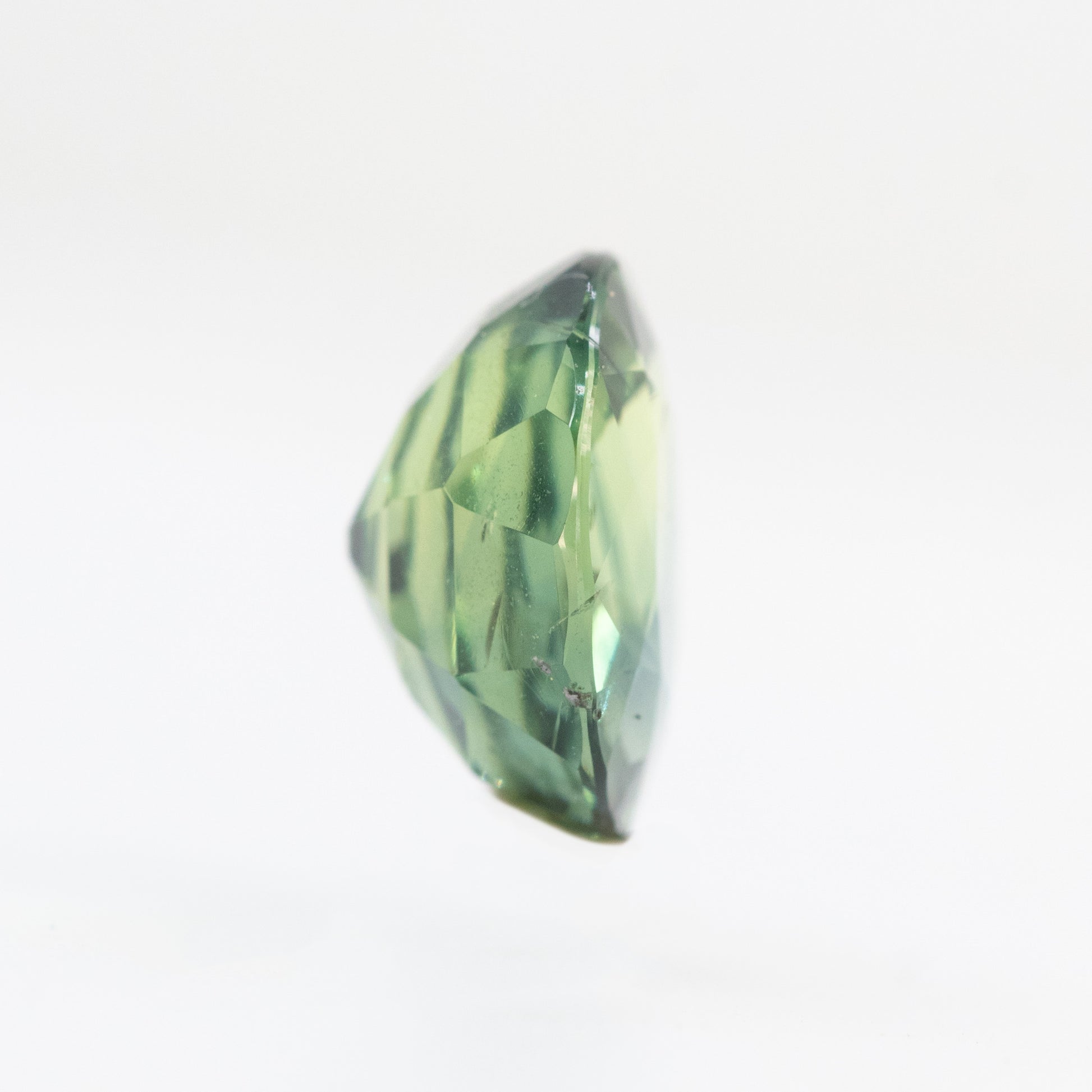CAELEN (J) 2.18 Carat Yellow-Green Oval Sapphire for Custom Work - Inventory Code MCOS218 - Midwinter Co. Alternative Bridal Rings and Modern Fine Jewelry