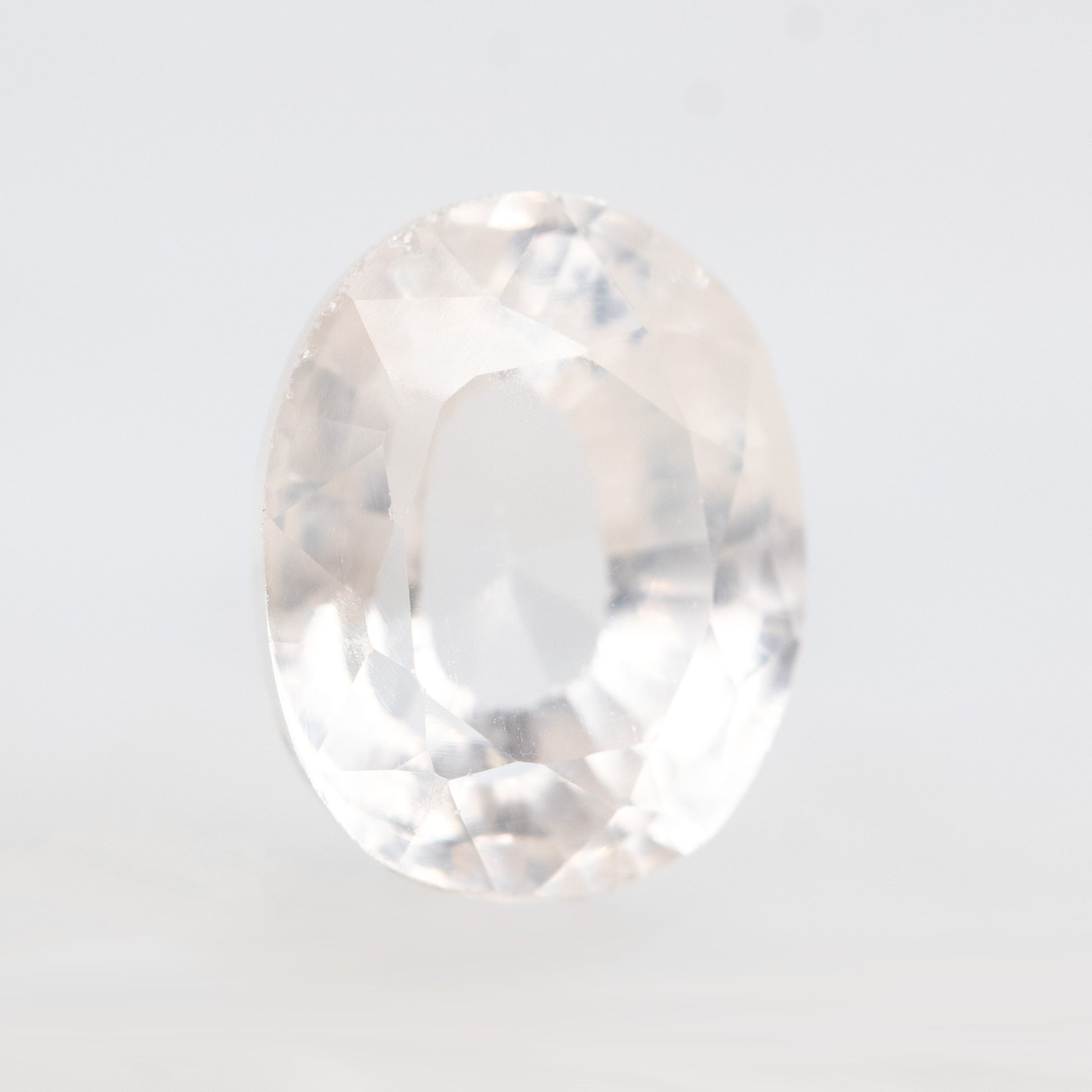 CAELEN (J)  7.28 Carat Clear Oval Lab Grown Sapphire for Custom Work - Inventory Code COS728 - Midwinter Co. Alternative Bridal Rings and Modern Fine Jewelry