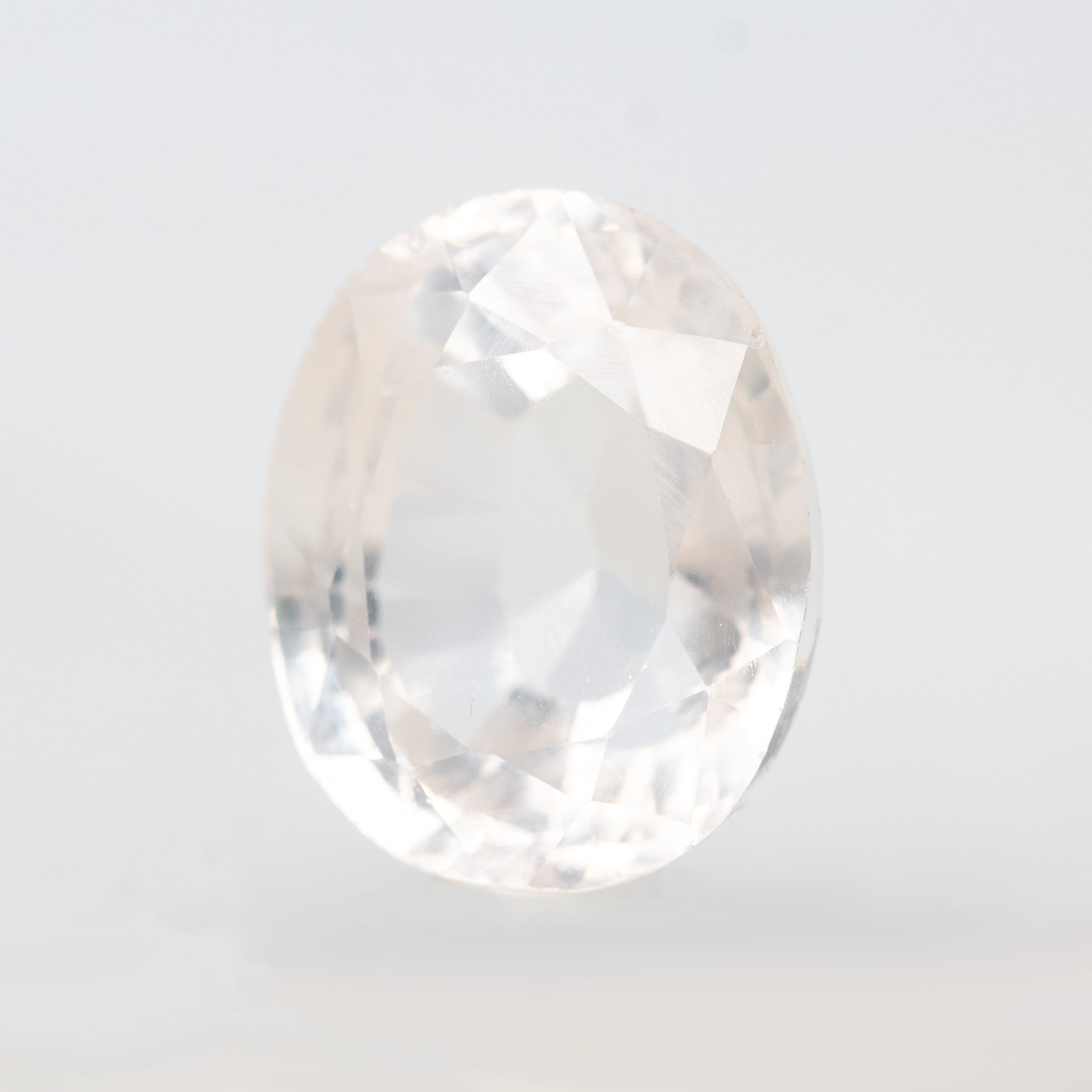 CAELEN (J)  7.28 Carat Clear Oval Lab Grown Sapphire for Custom Work - Inventory Code COS728 - Midwinter Co. Alternative Bridal Rings and Modern Fine Jewelry
