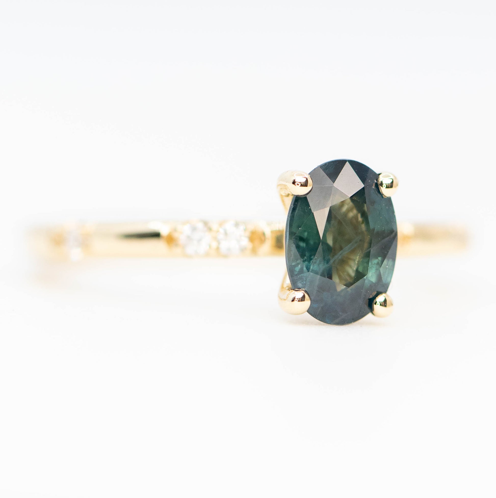Estelle Ring with a 1.03 Carat Teal Oval Sapphire and White Accent Diamonds in 14k Yellow Gold - Ready to Size and Ship - Midwinter Co. Alternative Bridal Rings and Modern Fine Jewelry