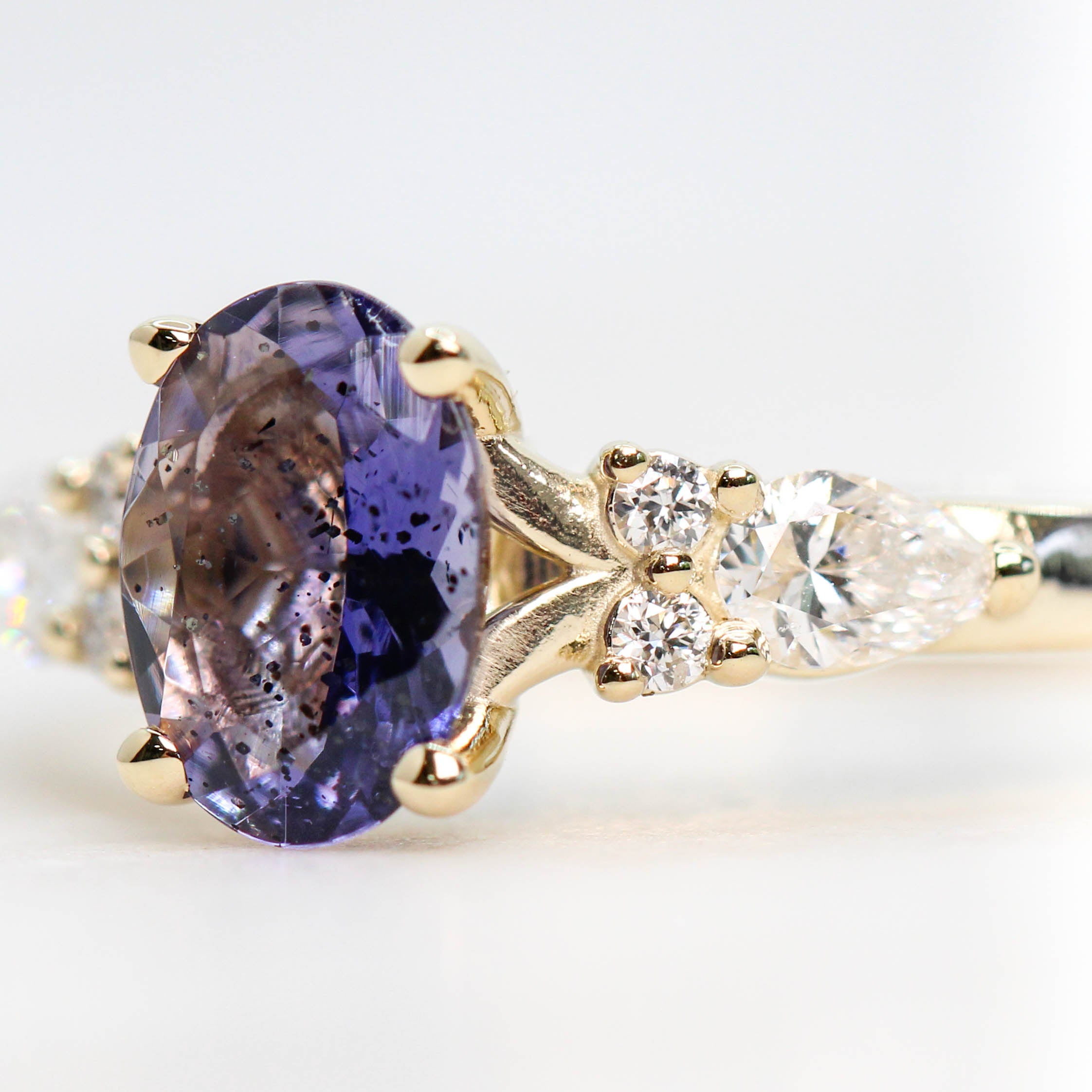 Jenna Ring with a 0.64 Carat Indigo Oval Iolite and White Accent Diamonds in 14k Yellow Gold - Ready to Size and Ship - Midwinter Co. Alternative Bridal Rings and Modern Fine Jewelry