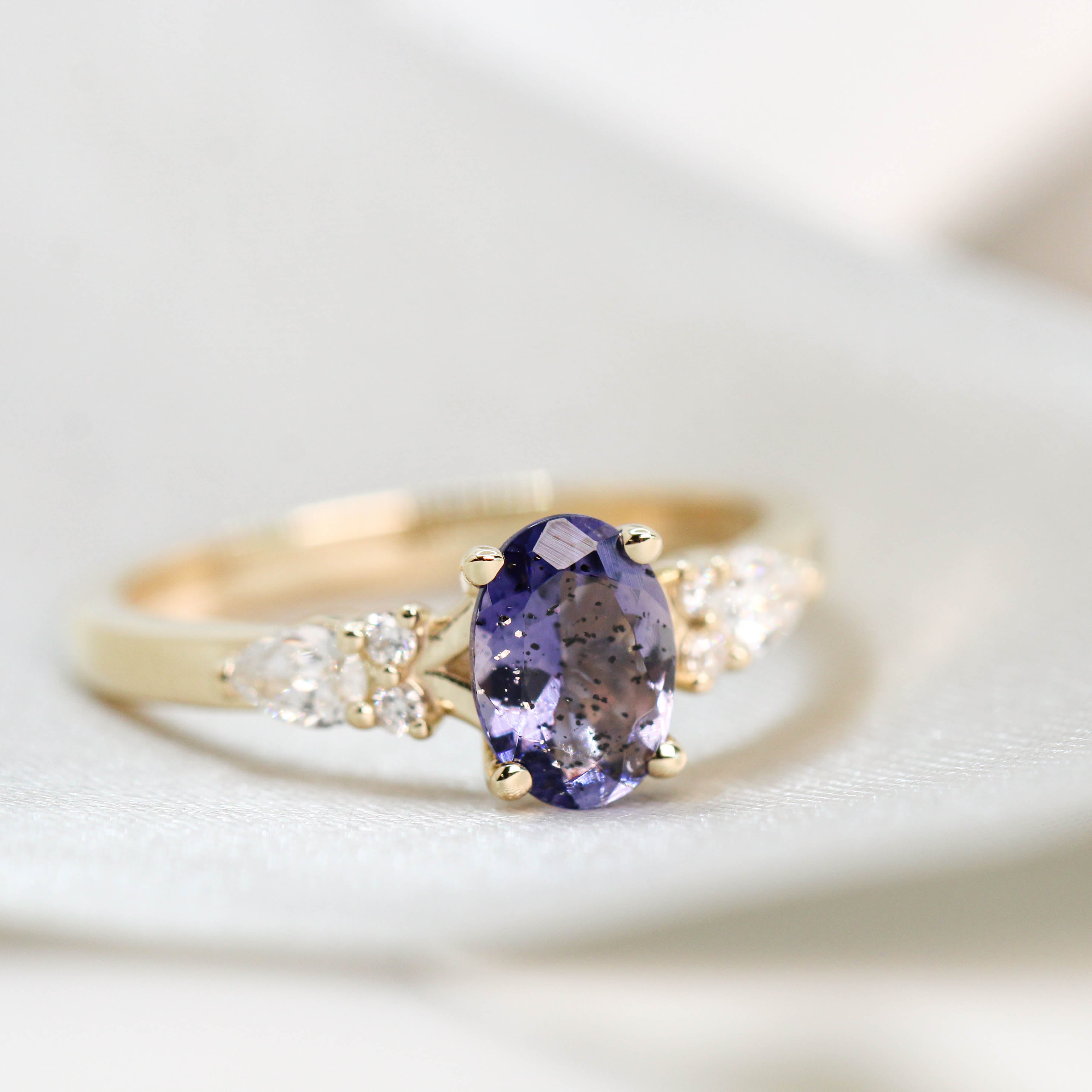 Jenna Ring with a 0.64 Carat Indigo Oval Iolite and White Accent Diamonds in 14k Yellow Gold - Ready to Size and Ship - Midwinter Co. Alternative Bridal Rings and Modern Fine Jewelry