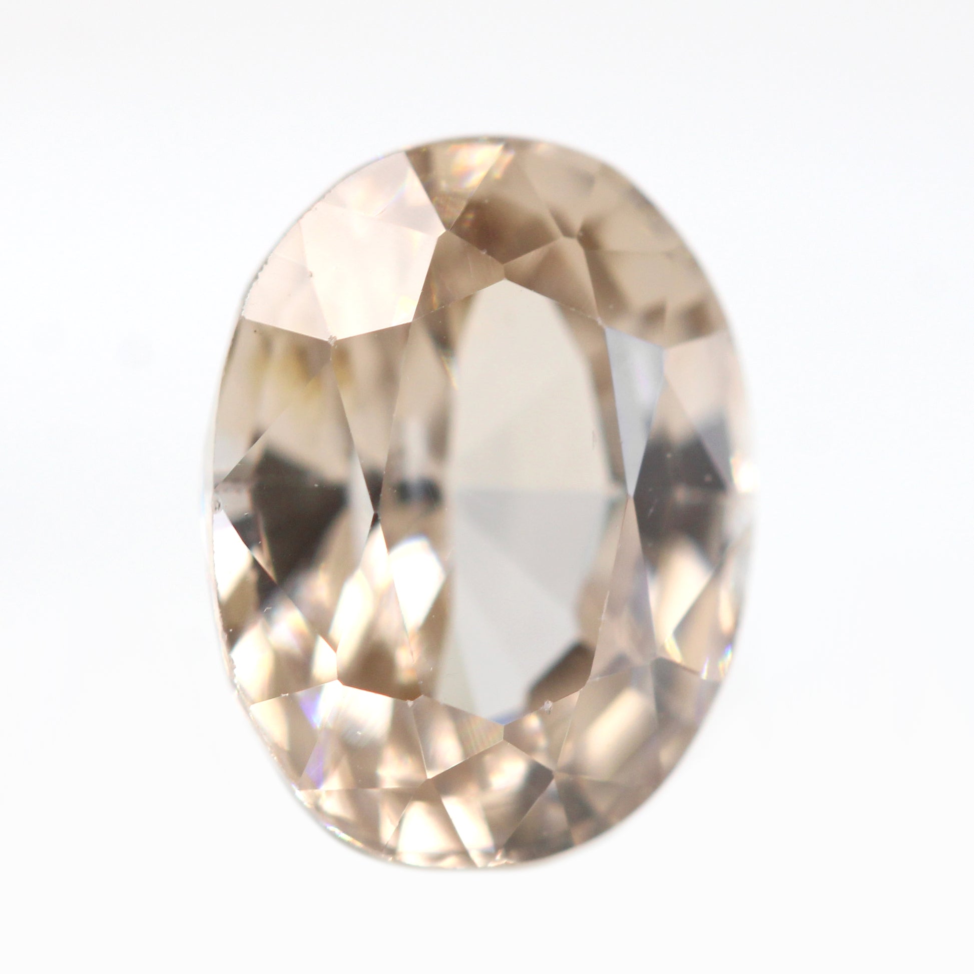 3.05 Carat Golden Light Peach Champagne Oval Sapphire for Custom Work - Inventory Code COS305 - Midwinter Co. Alternative Bridal Rings and Modern Fine Jewelry
