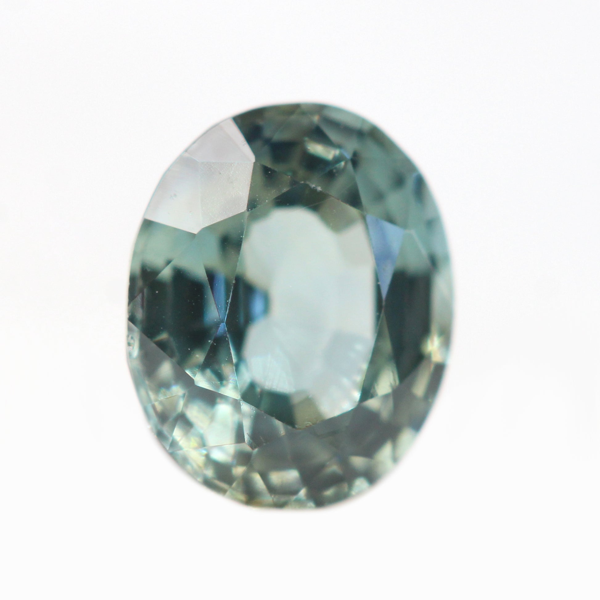 0.81 Carat Light Earthy Teal Oval Sapphire for Custom Work - Inventory Code TOS081 - Midwinter Co. Alternative Bridal Rings and Modern Fine Jewelry