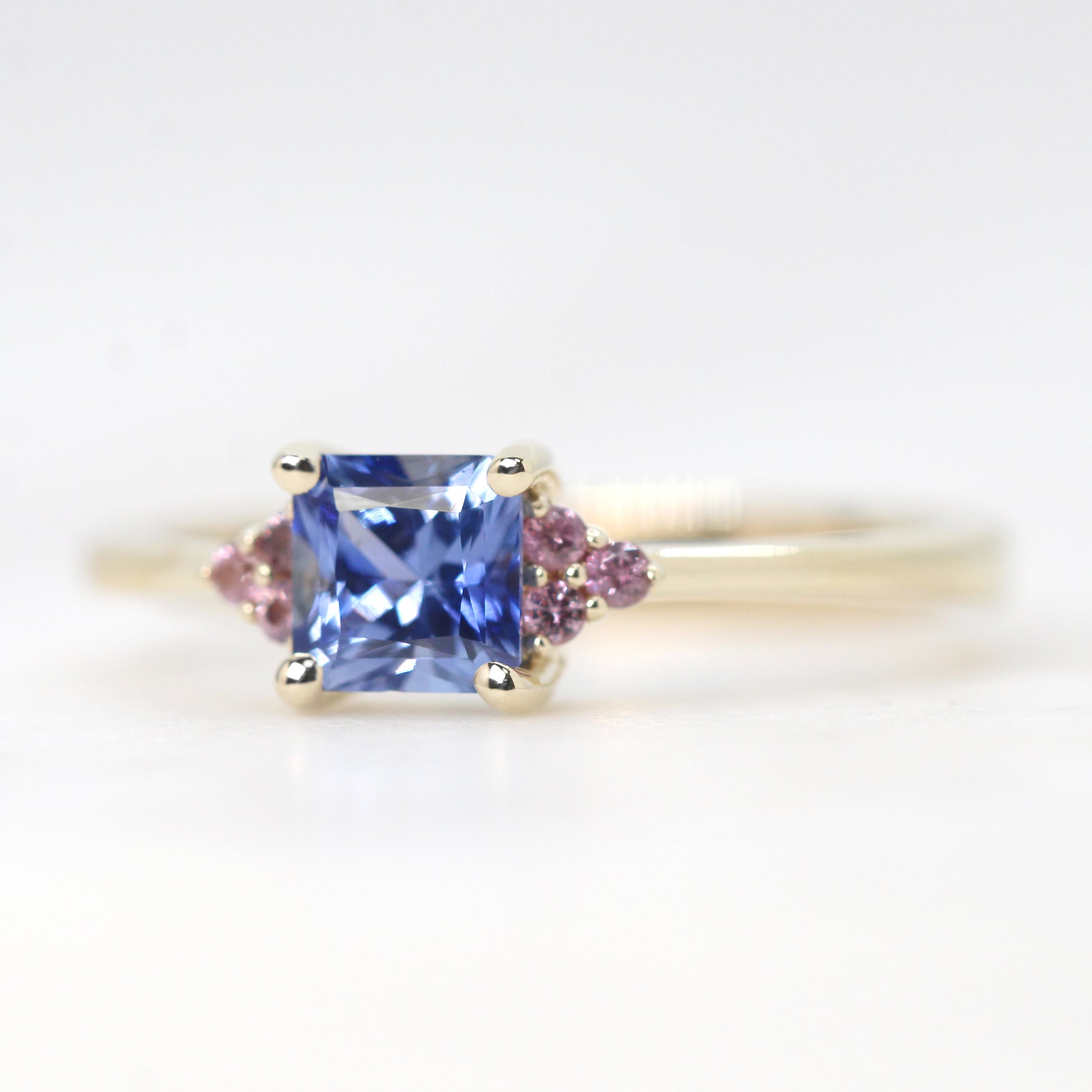Imogene Ring with a 0.78 Carat Cornflower Blue Radiant Cut Sapphire and Berry Sapphire Accents in 14k Yellow Gold - Ready to Size and Ship - Midwinter Co. Alternative Bridal Rings and Modern Fine Jewelry