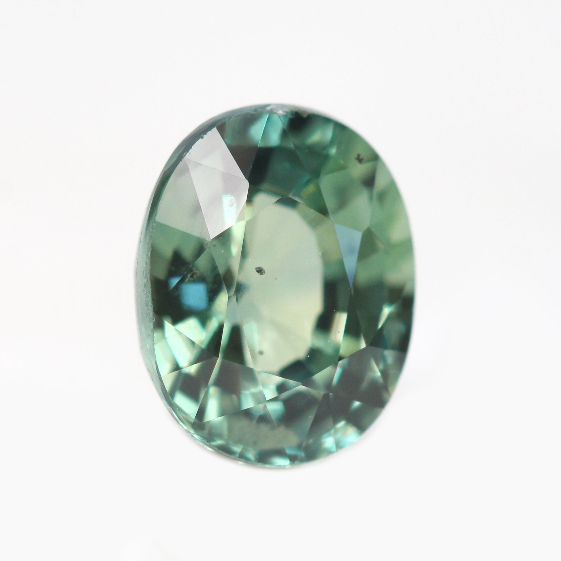 1.55 Carat Light Teal Green Oval Madagascar Sapphire for Custom Work - Inventory Code TGOS155 - Midwinter Co. Alternative Bridal Rings and Modern Fine Jewelry