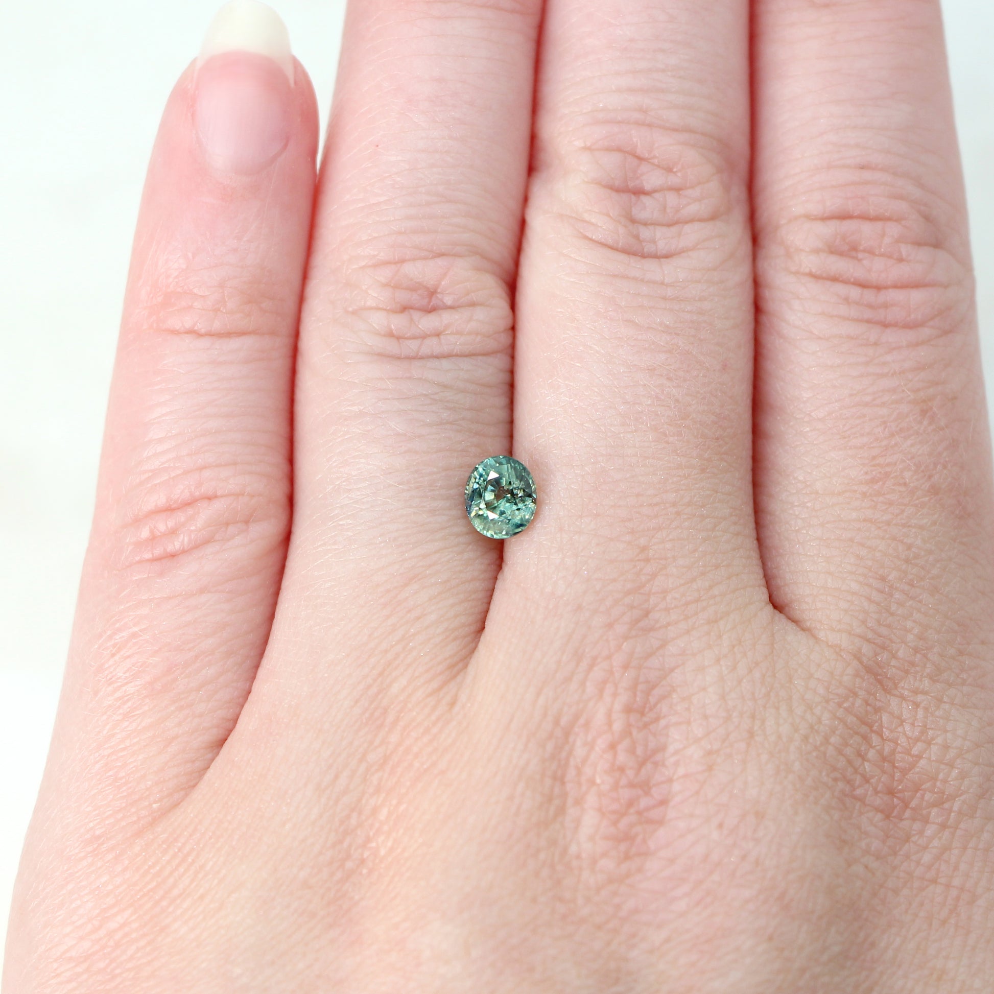 1.05 Carat Light Teal Oval Australian Sapphire for Custom Work - Inventory Code TOS105 - Midwinter Co. Alternative Bridal Rings and Modern Fine Jewelry