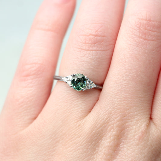 Aster Ring with a 1.03 Carat Teal Green Oval Montana Sapphire and White Canadian Diamond Accents in 14k White Gold - Ready to Size and Ship - Midwinter Co. Alternative Bridal Rings and Modern Fine Jewelry