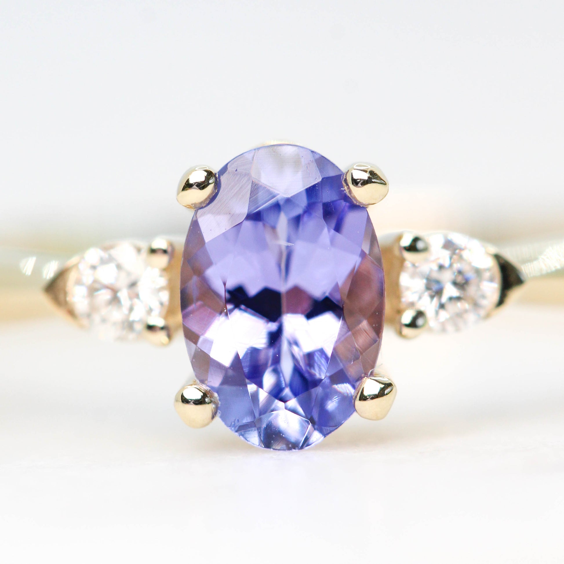 Chelsea Ring with an Oval Tanzanite and White Accent Diamonds in