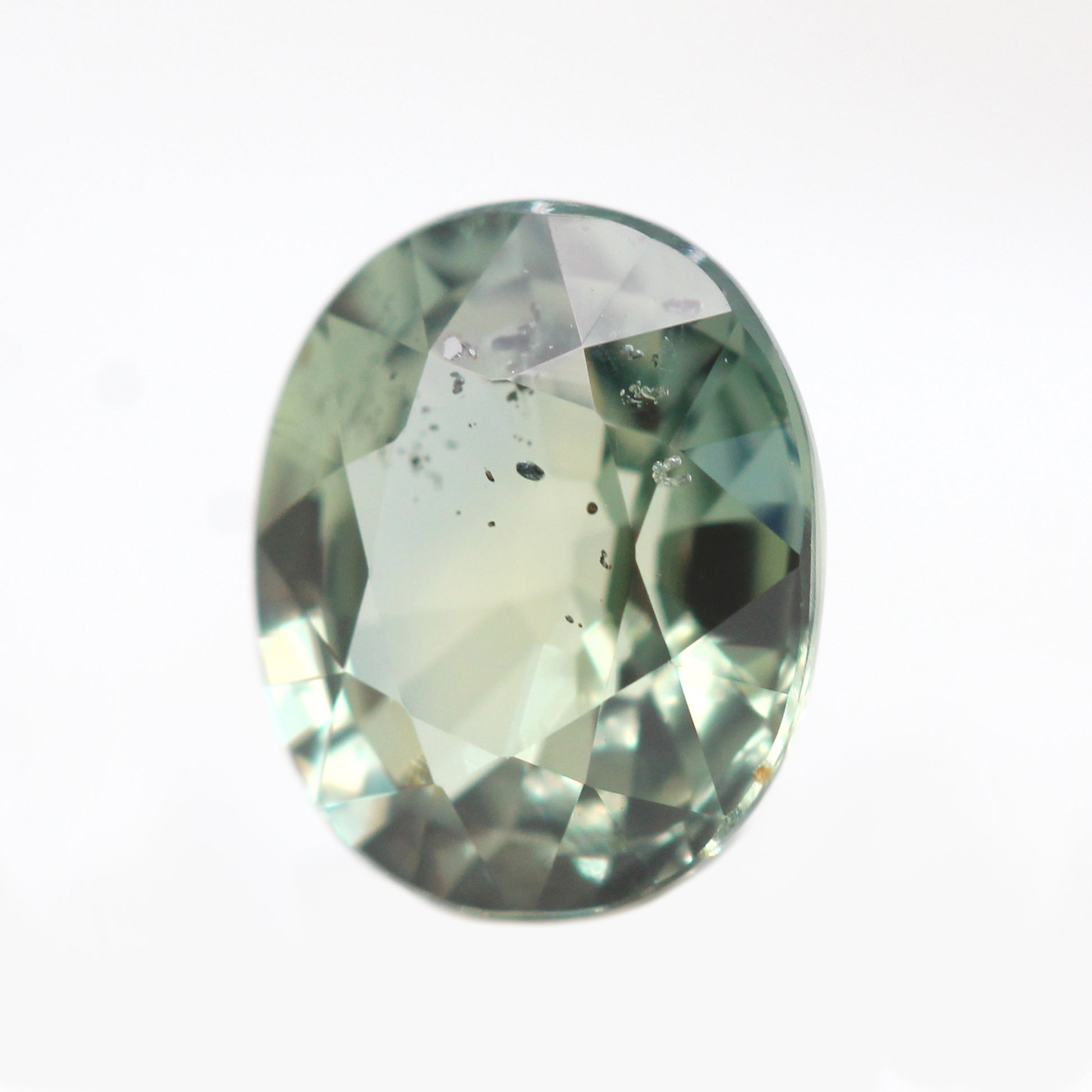 1.44 Carat Light Earthy Green Oval Sapphire for Custom Work - Inventory Code GOS144 - Midwinter Co. Alternative Bridal Rings and Modern Fine Jewelry