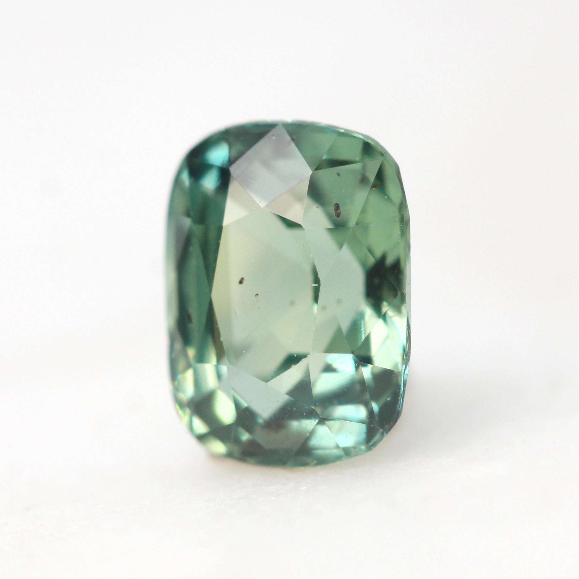 1.09 Carat Light Teal Green Cushion Cut Sapphire for Custom Work - Inventory Code TGCS109 - Midwinter Co. Alternative Bridal Rings and Modern Fine Jewelry