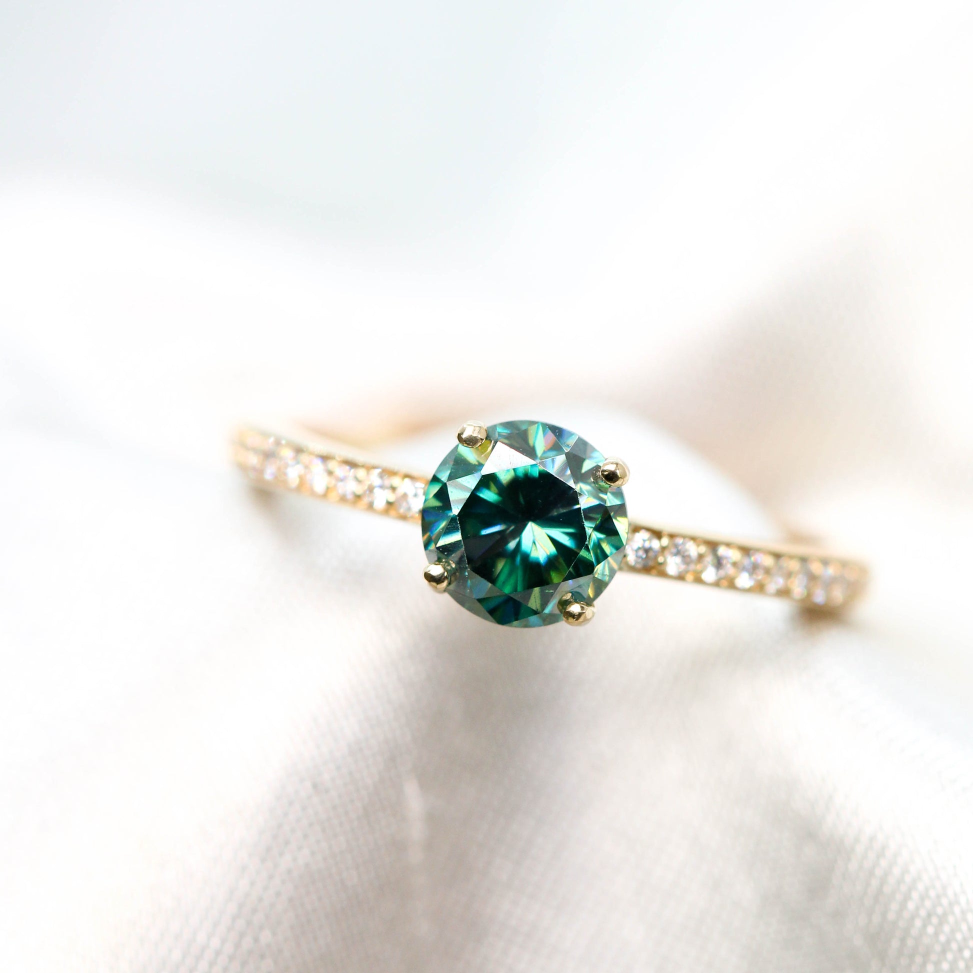 Imani Ring with a 0.80 Carat Round Black and Teal Moissanite and White Accent Diamonds in 14k Yellow Gold - Ready to Size and Ship - Midwinter Co. Alternative Bridal Rings and Modern Fine Jewelry