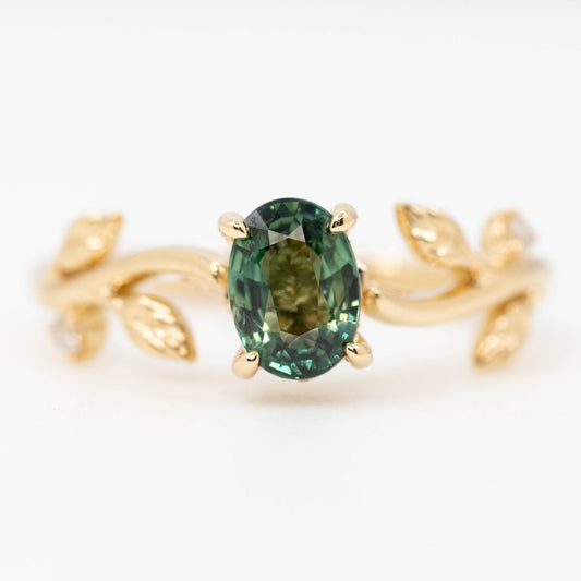 Vinia Ring with a 1.04 Carat Teal Oval Sapphire and White Accent and Hidden Diamonds in 14k Yellow Gold - Ready to Size and Ship