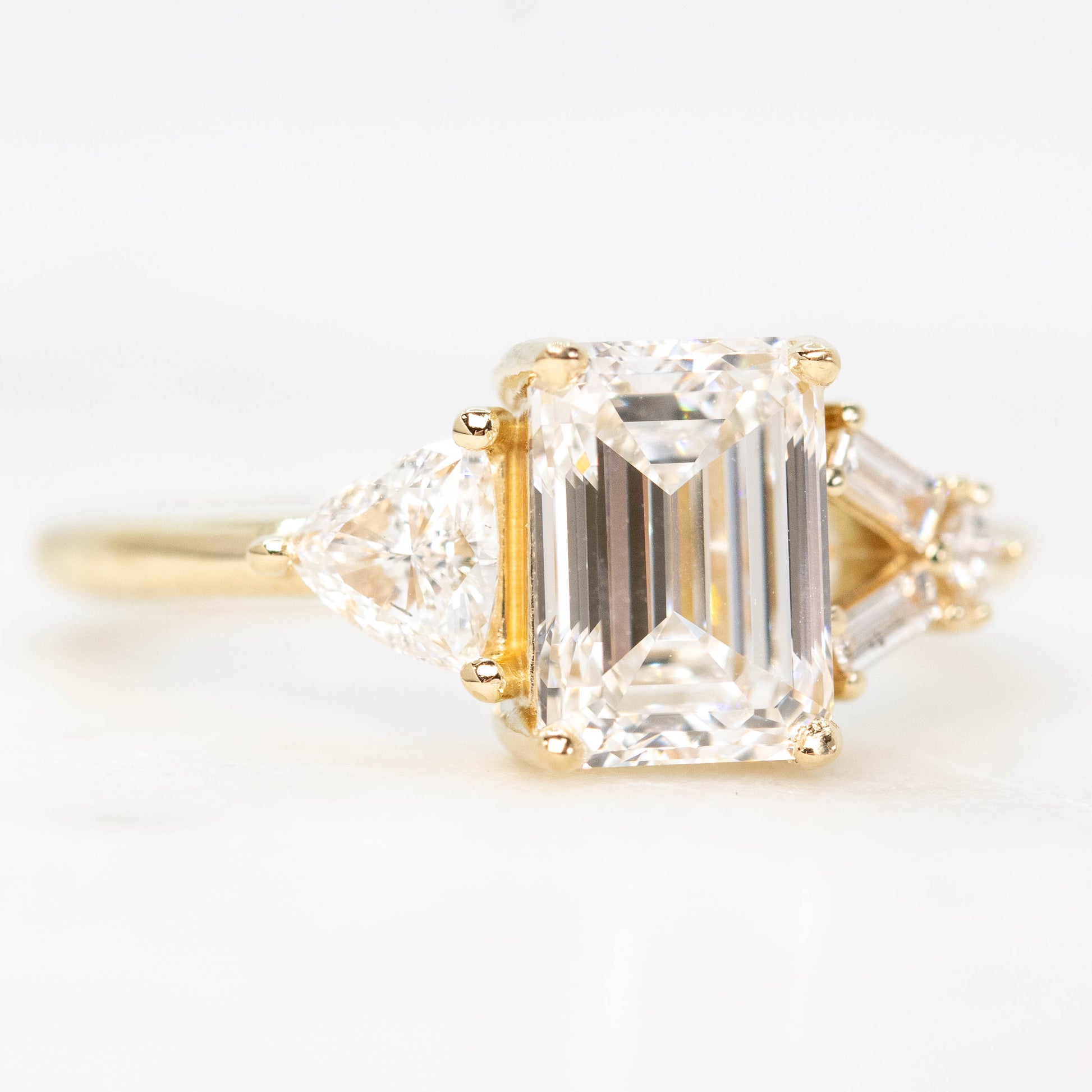 Meridith Ring with a 1.91 Carat Emerald Cut Lab Grown Diamond and Natural White Accent Diamonds in 14k Yellow Gold - Ready to Size and Ship - Midwinter Co. Alternative Bridal Rings and Modern Fine Jewelry