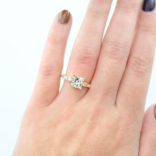 River Ring with a 1.69 Carat Princess Cut Lab Grown Diamond and White Accent Diamonds in 14k Yellow Gold - Ready to Size and Ship