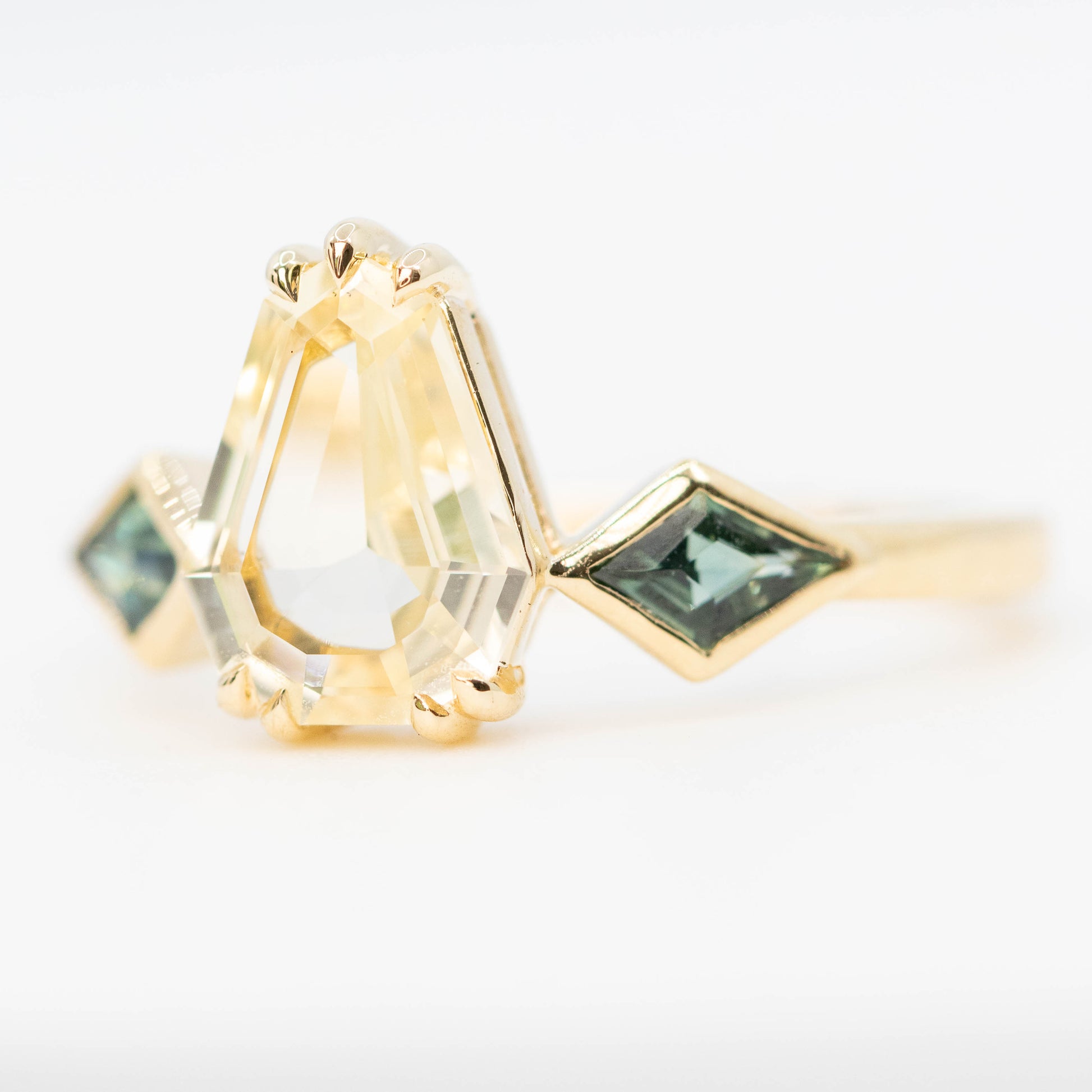 Vespera Ring with a 1.74 Carat Clear Yellow Geometric Pear Sapphire and Teal Sapphire Accents in 14k Yellow Gold - Ready to Size and Ship - Midwinter Co. Alternative Bridal Rings and Modern Fine Jewelry