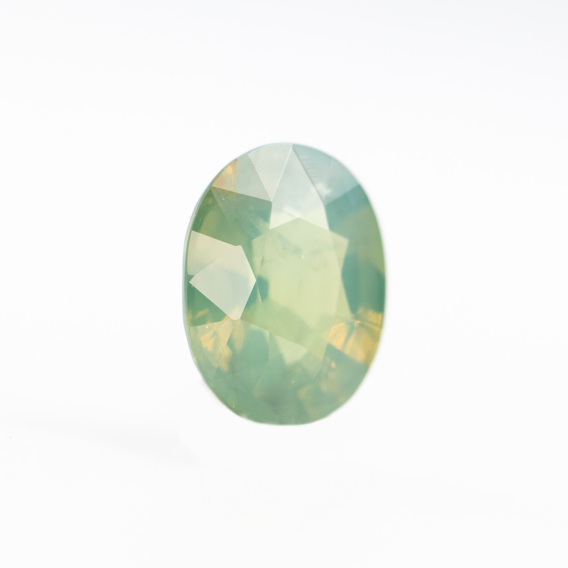 0.92 Carat Slightly Opalescent Yellow-Green Oval Sapphire for Custom Work - Inventory Code YGOS092 - Midwinter Co. Alternative Bridal Rings and Modern Fine Jewelry