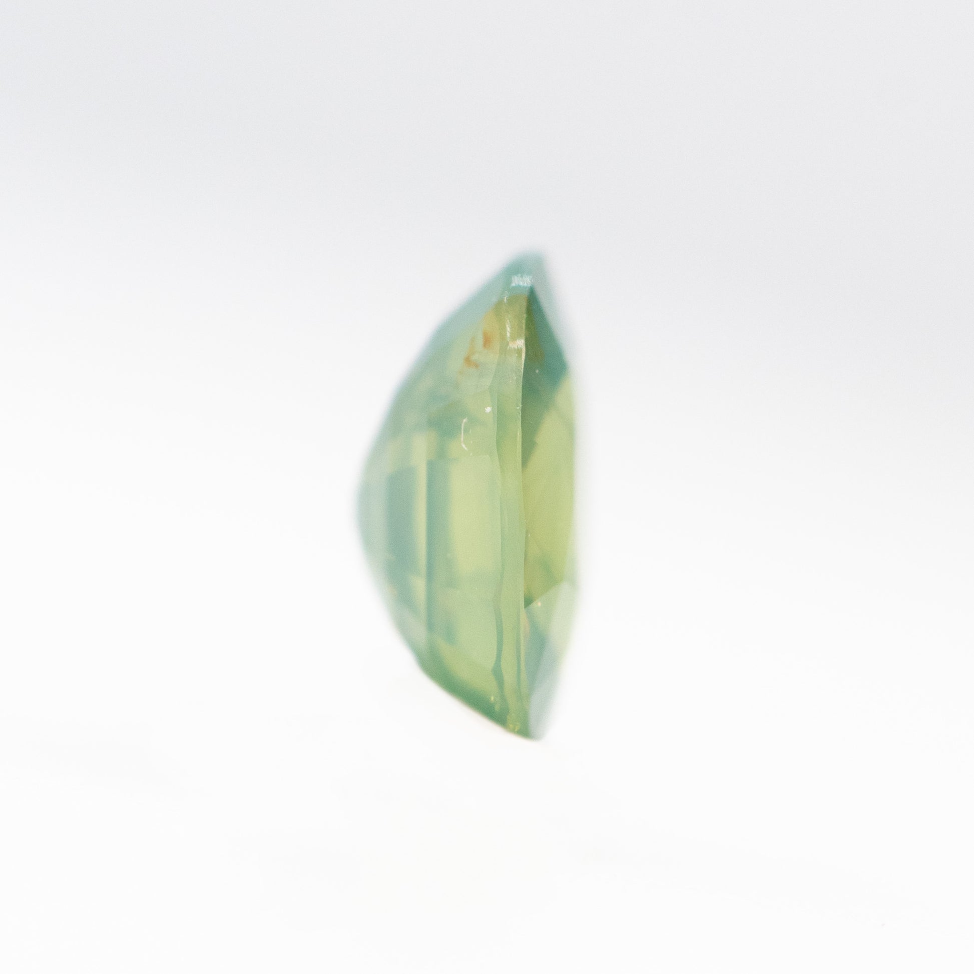 0.92 Carat Slightly Opalescent Yellow-Green Oval Sapphire for Custom Work - Inventory Code YGOS092 - Midwinter Co. Alternative Bridal Rings and Modern Fine Jewelry
