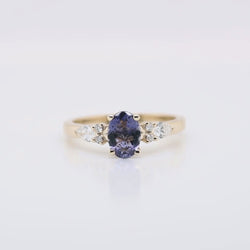Jenna Ring with a 0.64 Carat Indigo Oval Iolite and White Accent Diamonds in 14k Yellow Gold - Ready to Size and Ship