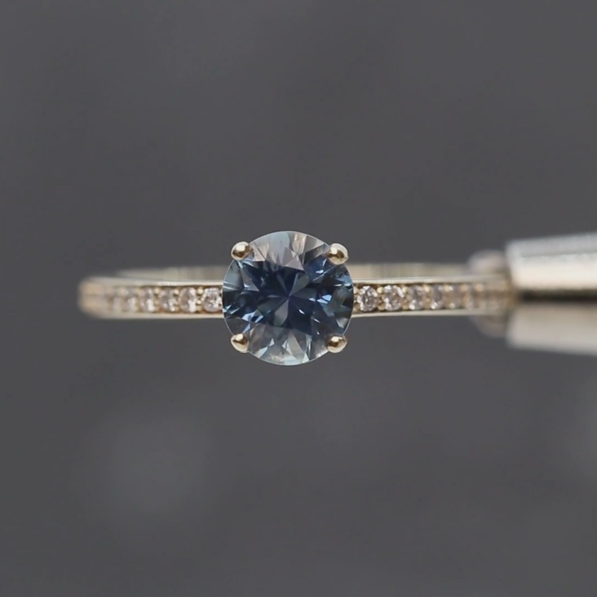 Imani Ring with a 0.96 Carat Round Blue Sapphire and White Accent Diamonds in 14k Yellow Gold -  Ready to Size and Ship