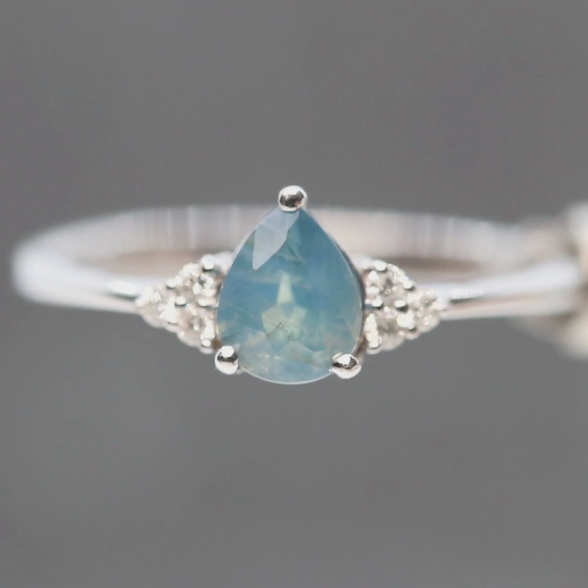 Imogene Ring with a 0.77 Carat Opalescent Blue Pear Sapphire and White Accent Diamonds in 14k White Gold - Ready to Size and Ship