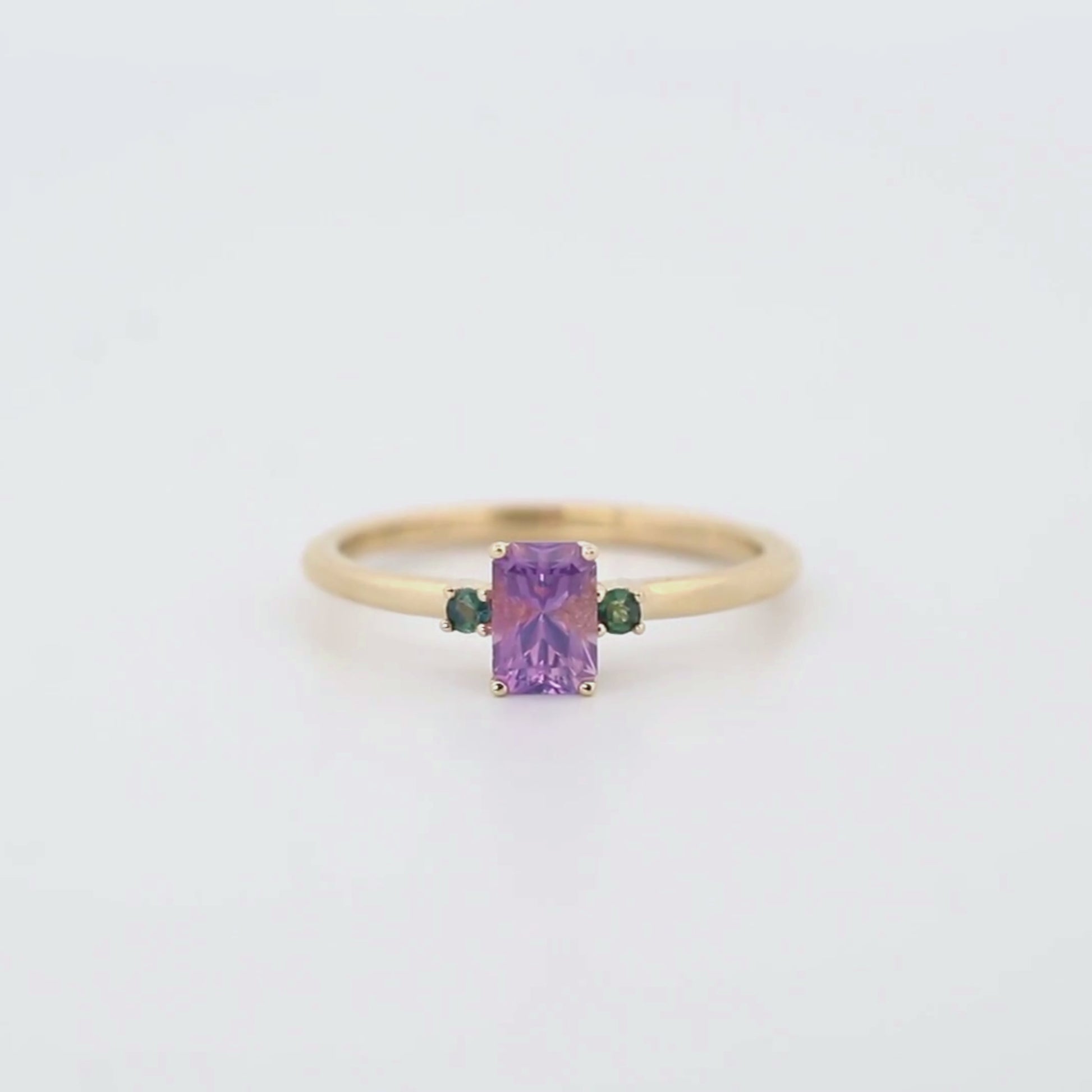 Terra Ring with a 0.81 Carat Radiant Cut Purple Sapphire and Teal Sapphire Accents in 14k Yellow Gold - Ready to Size and Ship