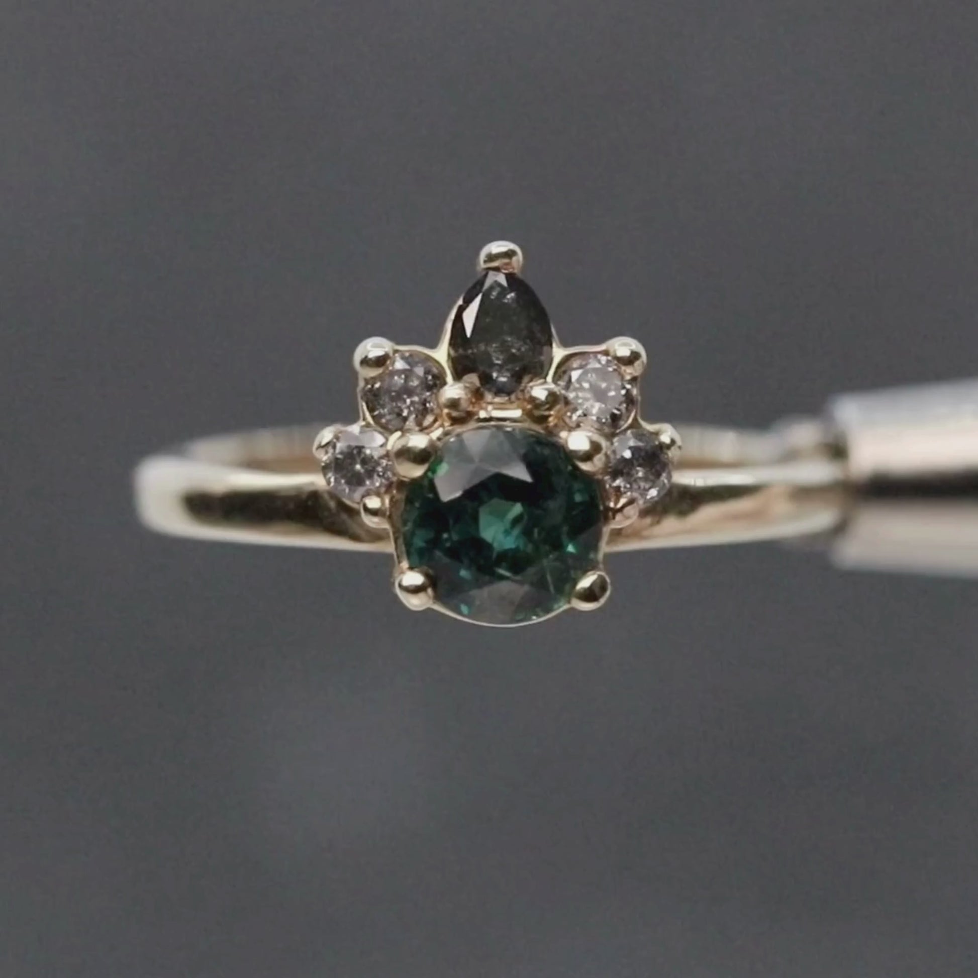 Blair Ring with a 1.09 Carat Round Teal Green Sapphire and Gray and Black Accent Diamonds in 10k Yellow Gold - Ready to Size and Ship