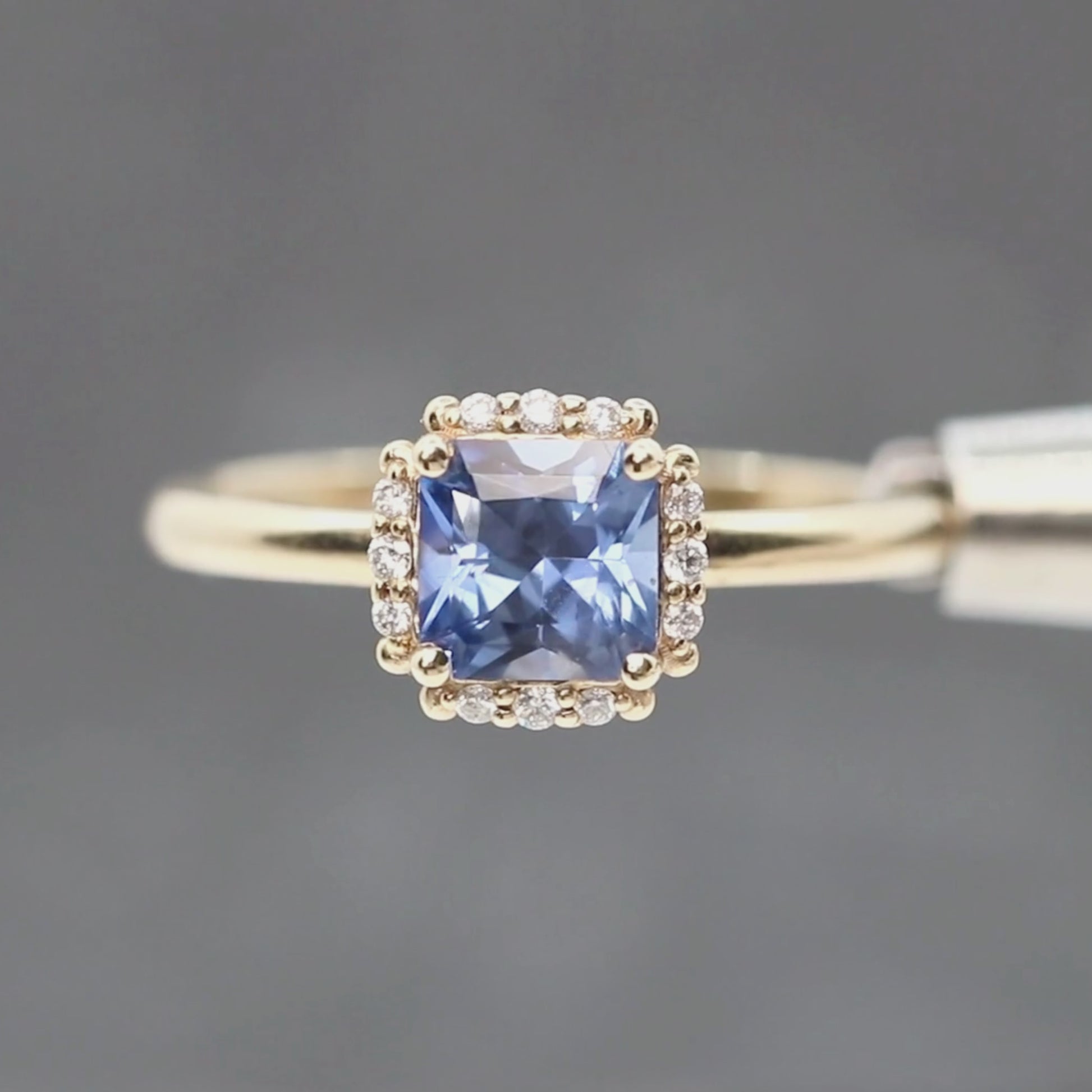 Astrid Ring with a 1.08 Carat Radiant Cut Blue Sapphire and White Accent Diamonds in 10k Yellow Gold - Ready to Size and Ship
