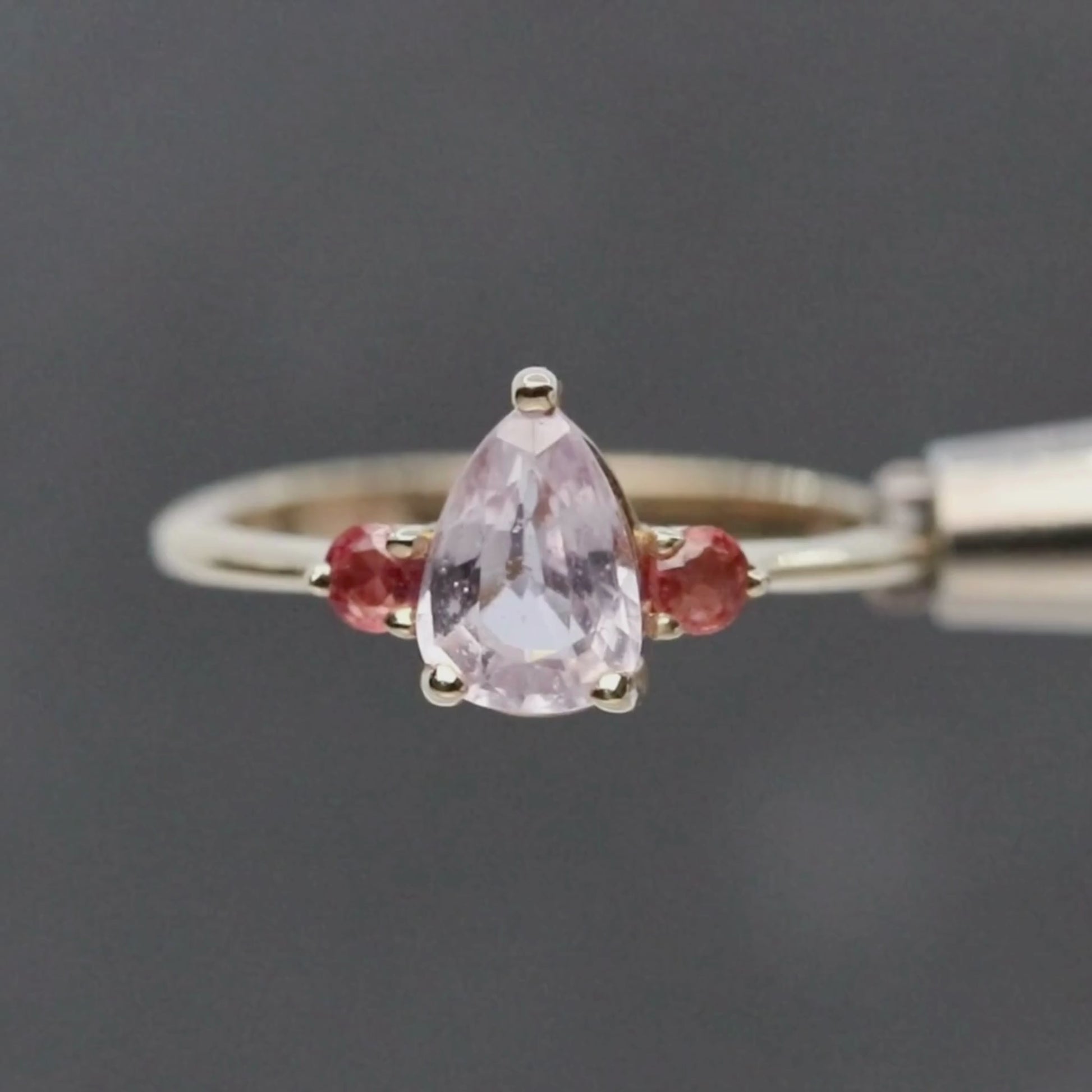 Drea Ring with a 1.32 Carat Pink Pear Sapphire and Orange Sapphire Accents in 14k Yellow Gold - Ready to Size and Ship