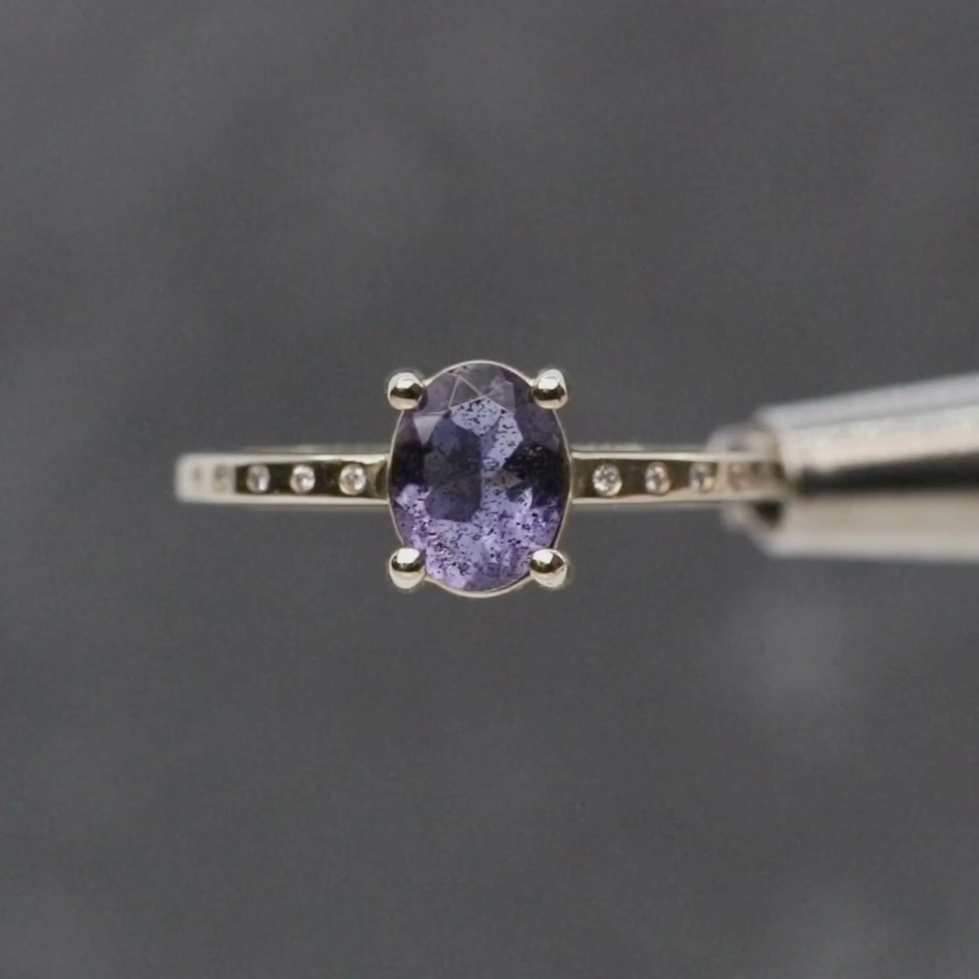 Heath Ring with a 0.74 Carat Oval Iolite and White Accent Diamonds in 14k Yellow Gold - Ready to Size and Ship